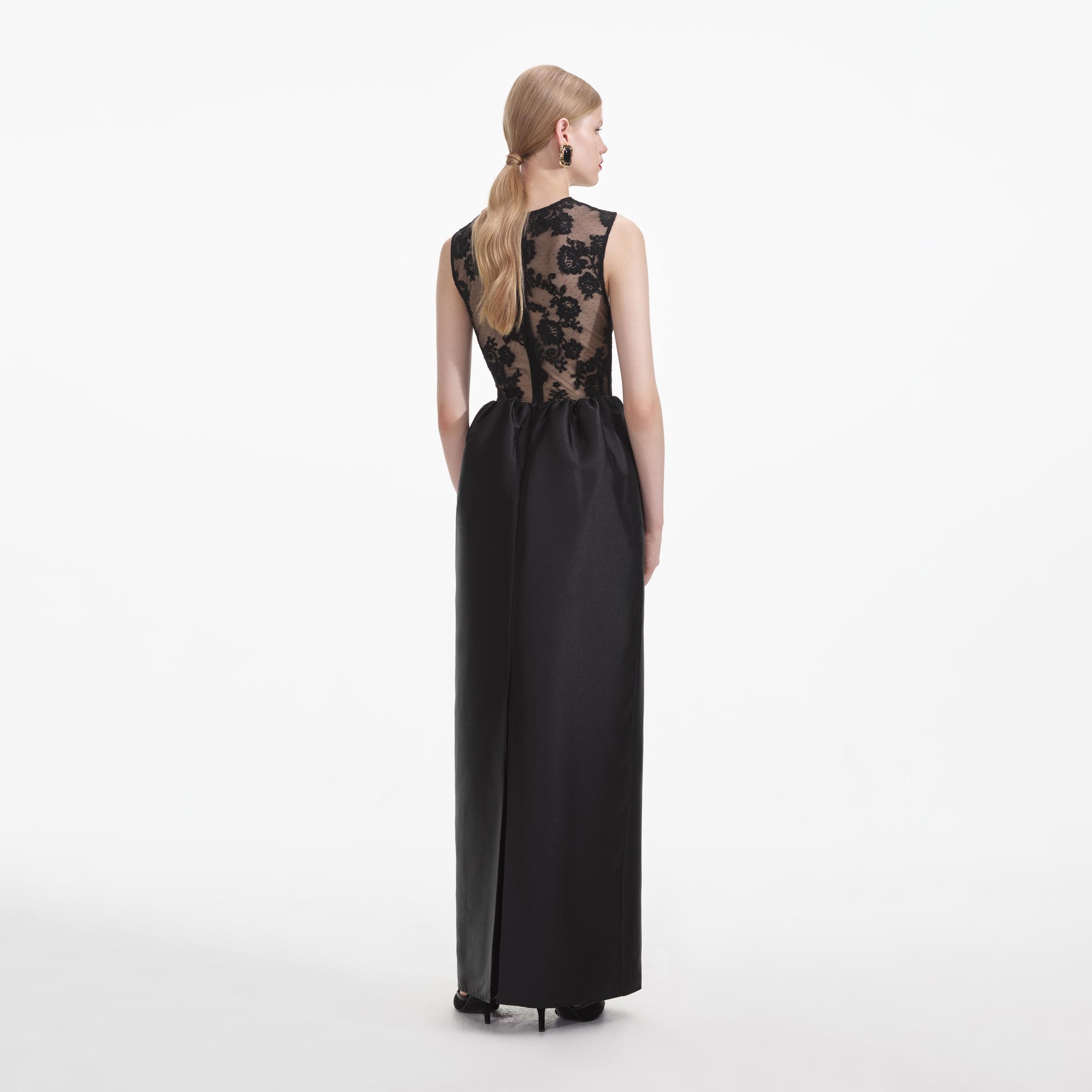Back view of a woman wearing the Black Lace Taffeta Maxi Dress