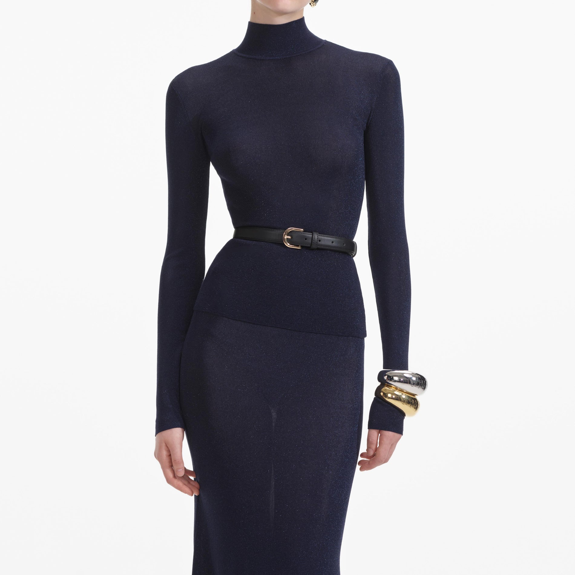 A close up of a woman wearing the Navy Viscose Knit Top