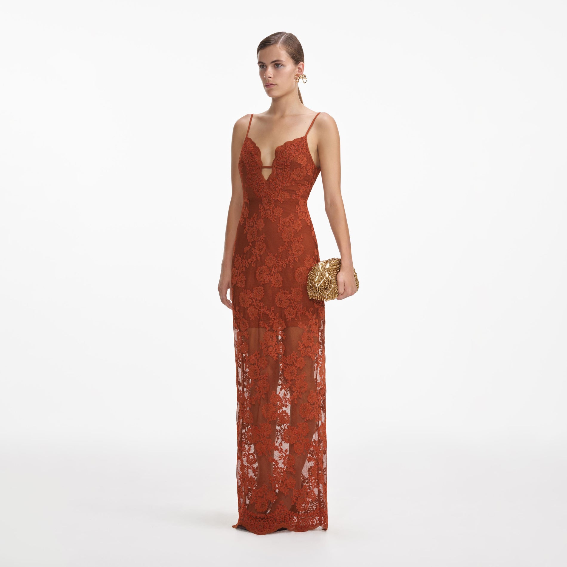 Side view of a woman wearing the Brown Lace Maxi Dress