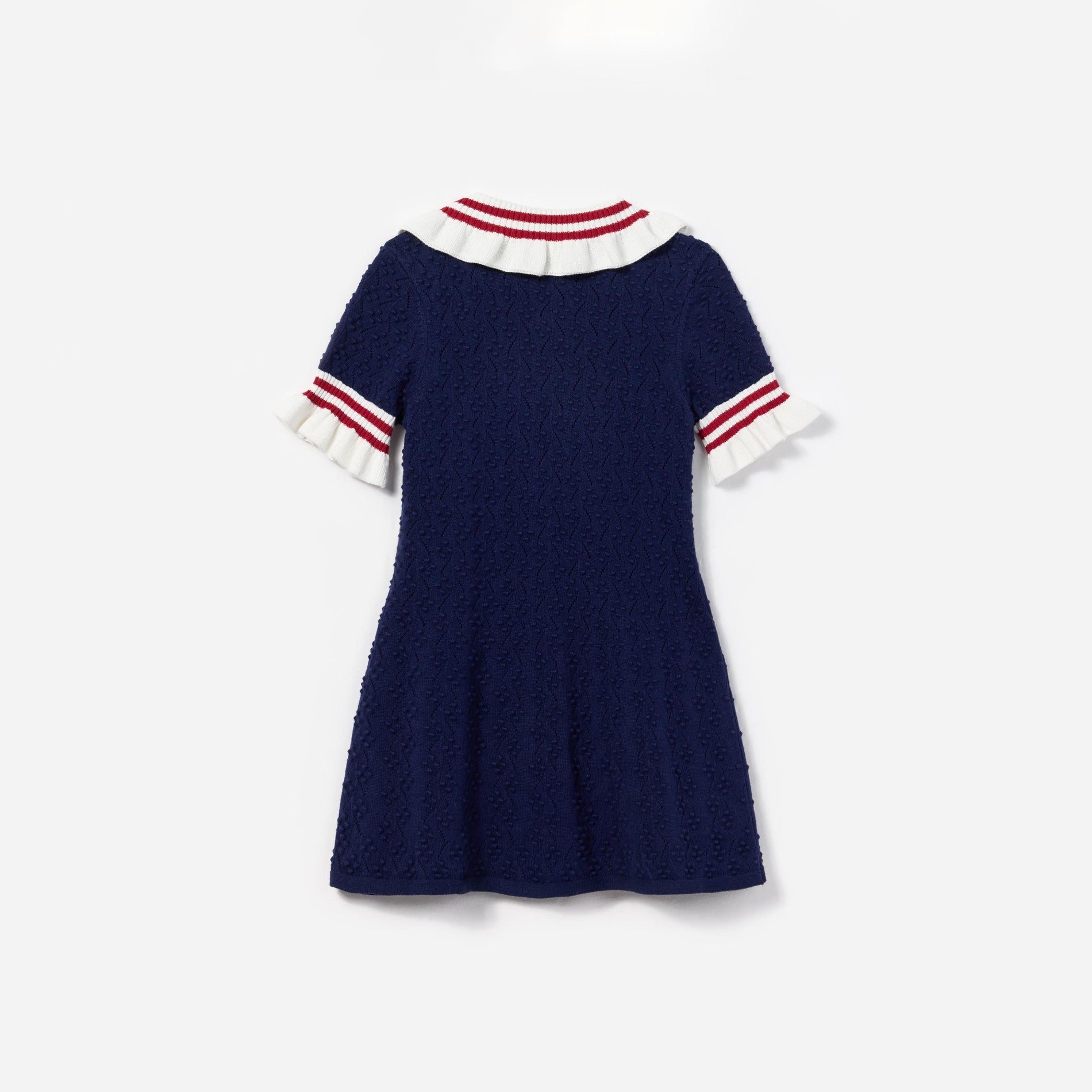 Side view of a woman wearing the Navy Textured Knit Dress