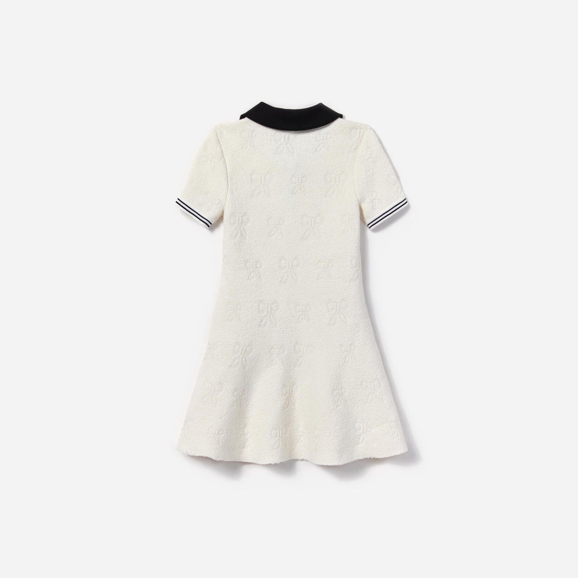 Side view of a woman wearing the White Jacquard Knit Dress