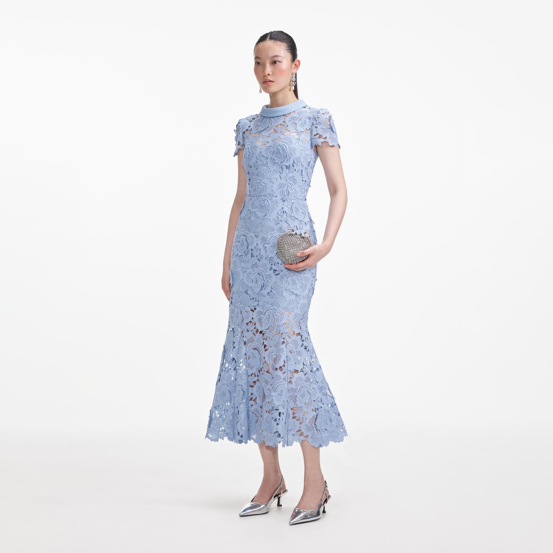 Side view of a woman wearing the Blue Flower Lace Contrast Collar Midi Dress