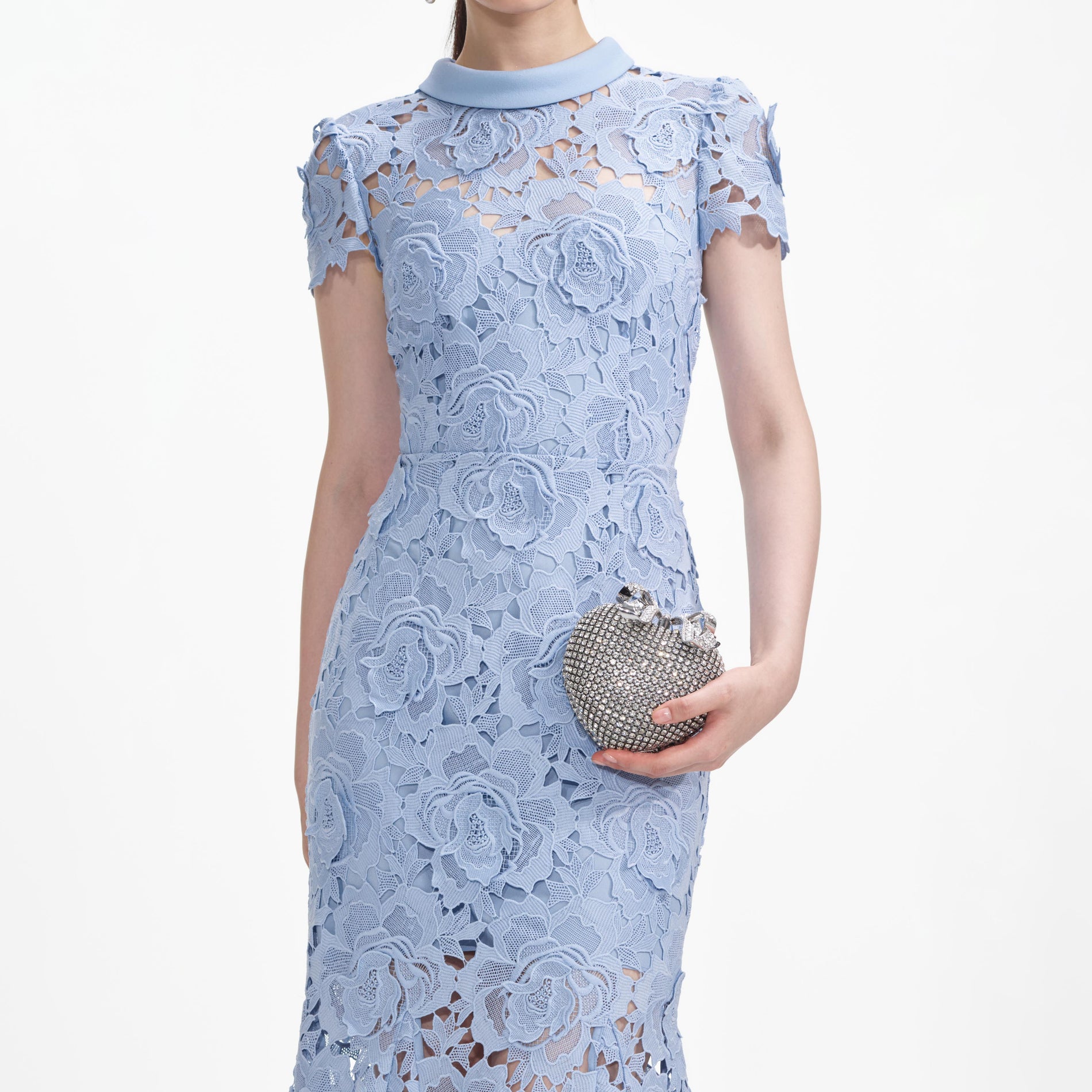 A close up of a woman wearing the Blue Flower Lace Contrast Collar Midi Dress
