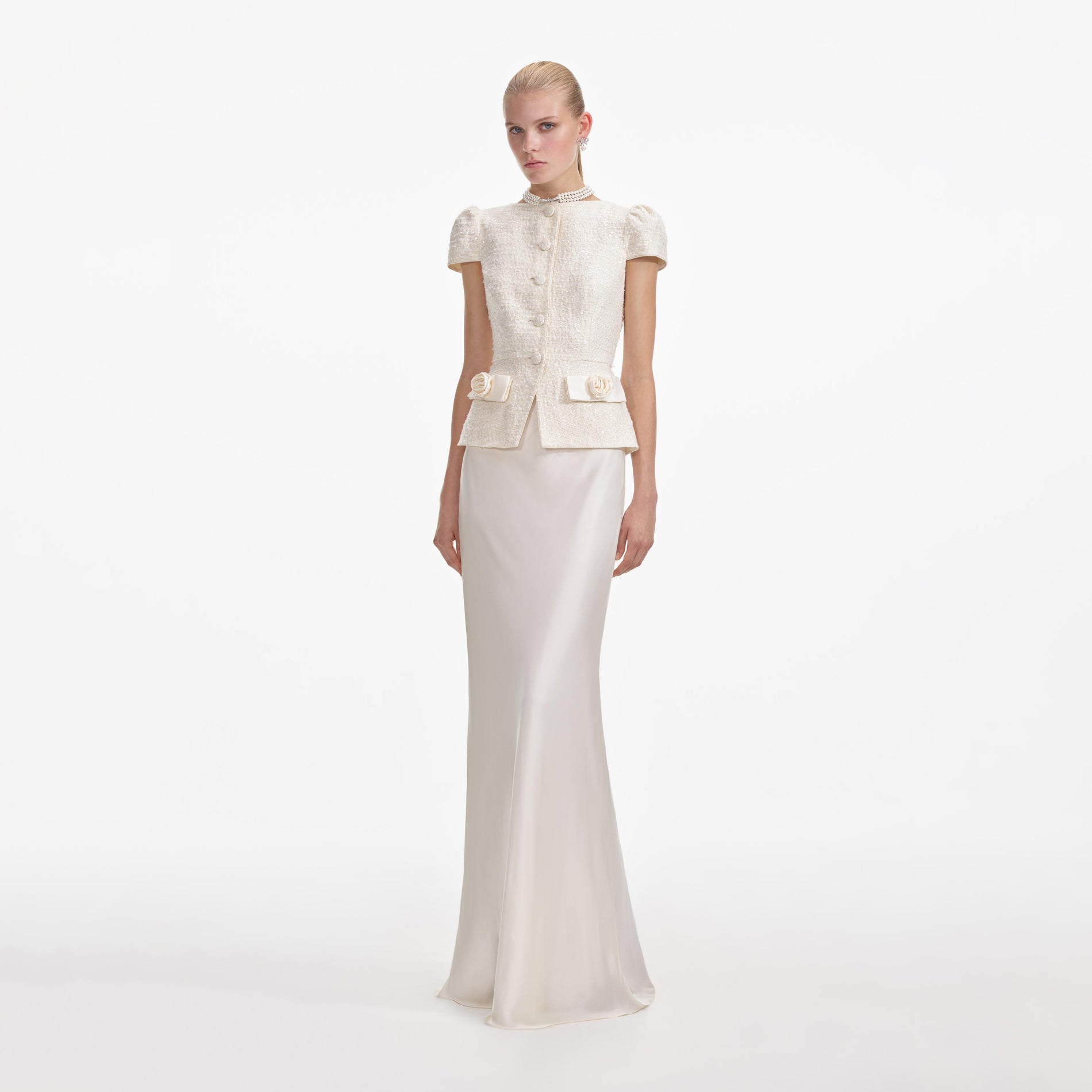 Side view of a woman wearing the Cream Boucle Bow Detail Maxi Dress