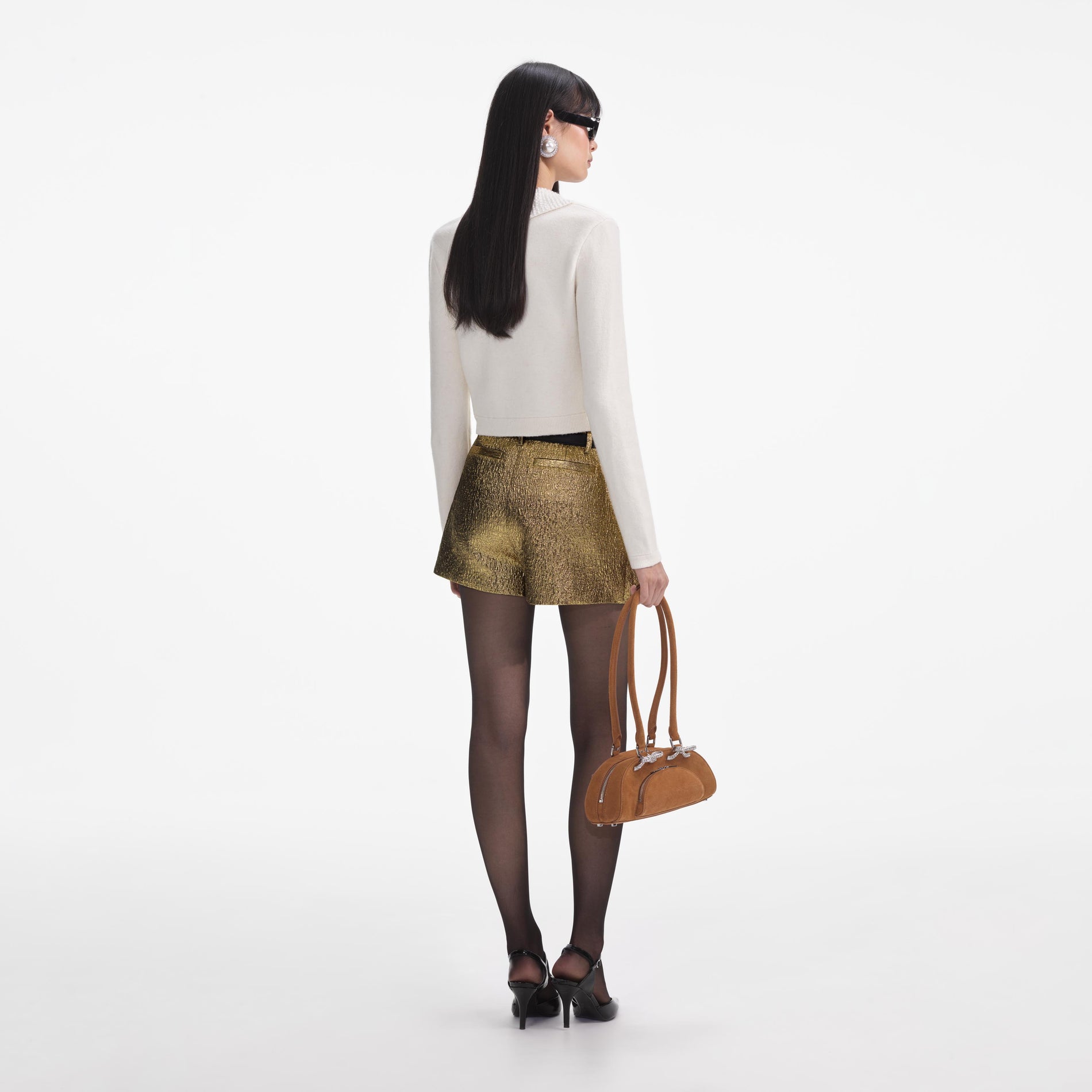 Back view of a woman wearing the Cream Pearl Collar Alpaca Knit Top