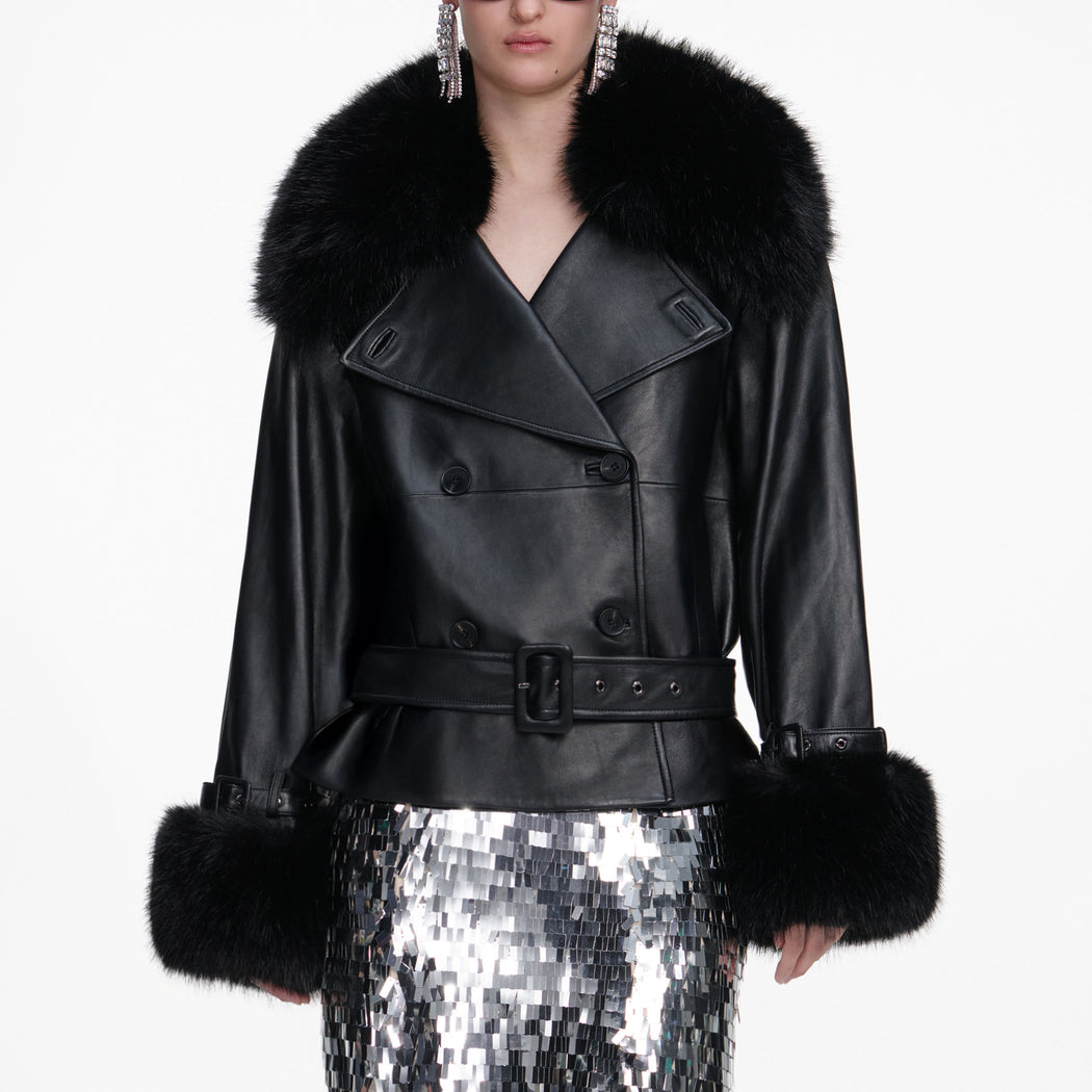 A close up of a woman wearing the Black Belted Leather Jacket