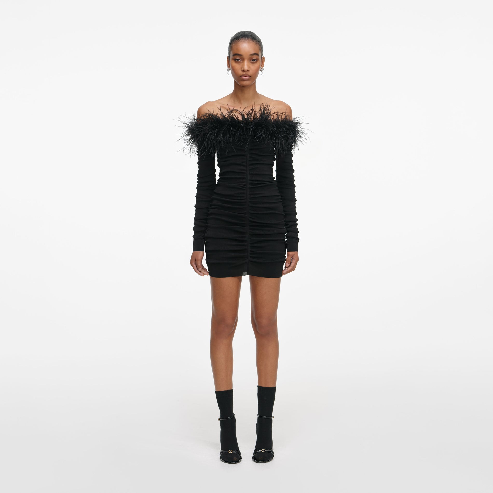 Front view of a woman wearing the Black Feather Viscose Knit Mini Dress