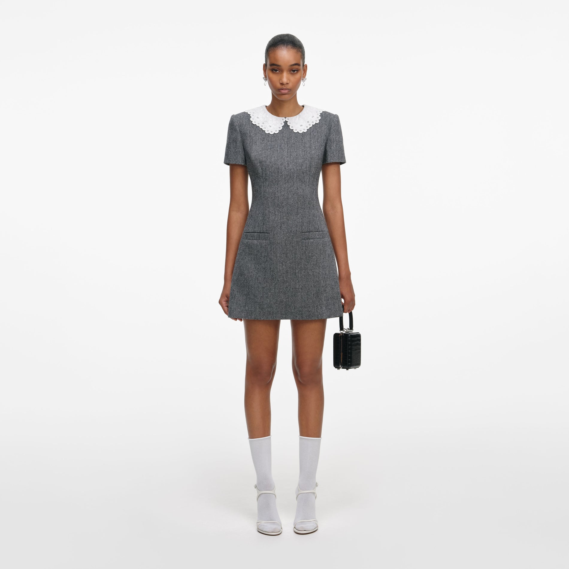 Front view of a woman wearing the Grey Herringbone Collared Mini Dress