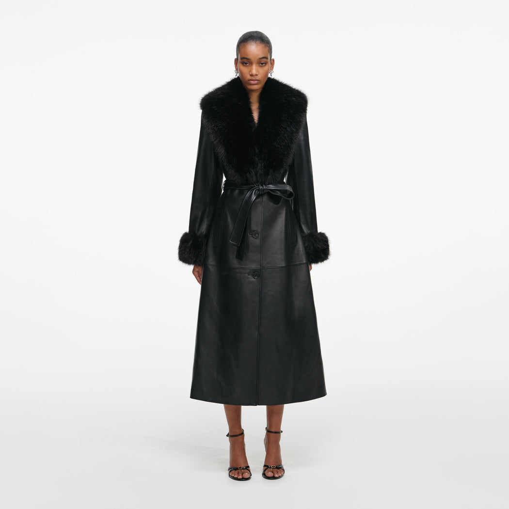 Front view of a woman wearing the Black Leather Faux Fur Collared Coat