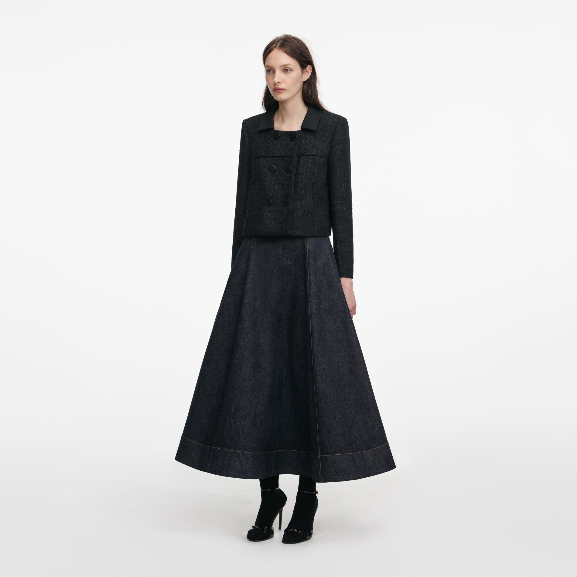 Side view of a woman wearing the Black Boucle Cropped Jacket