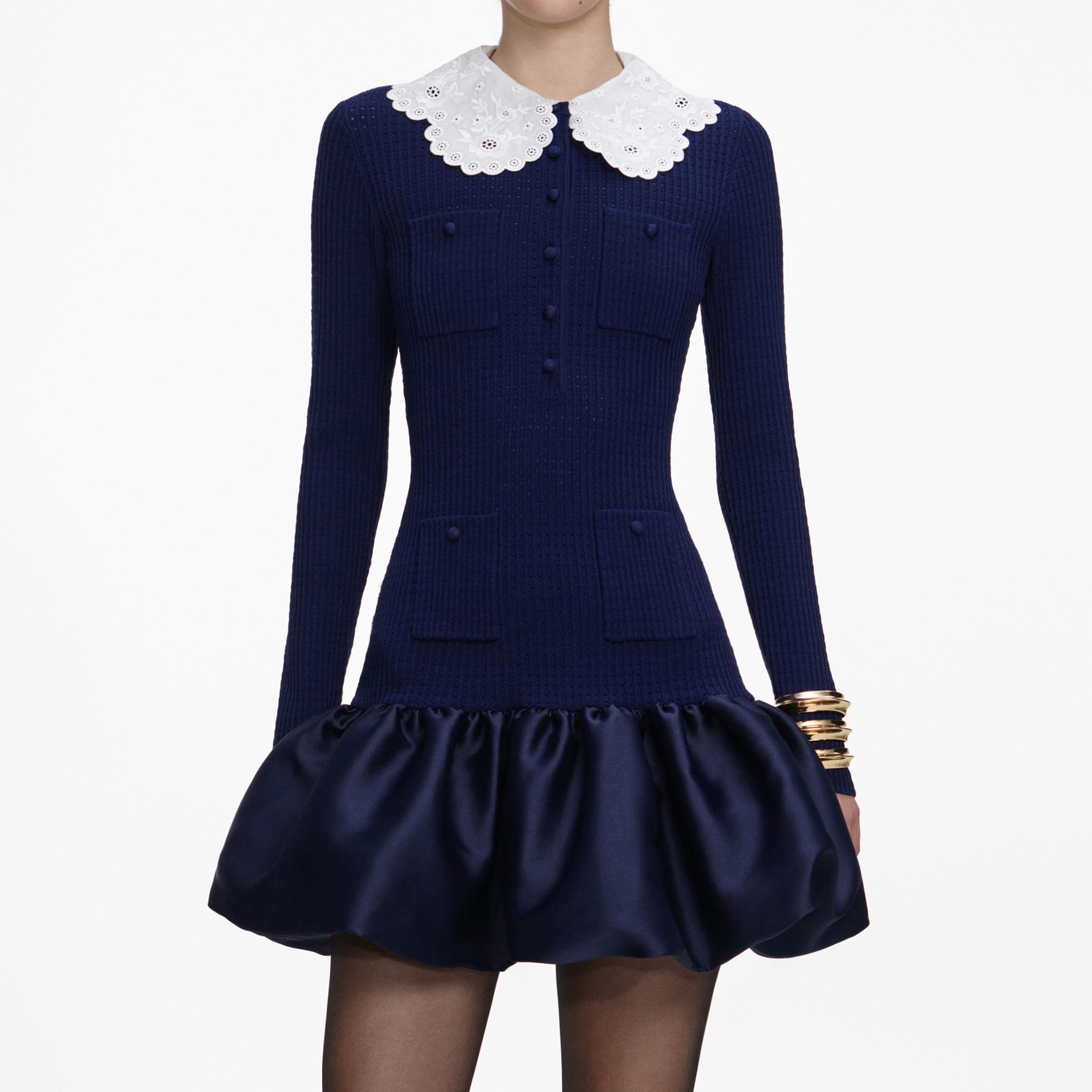A close up of a woman wearing the Navy Knit Taffeta Mini Dress