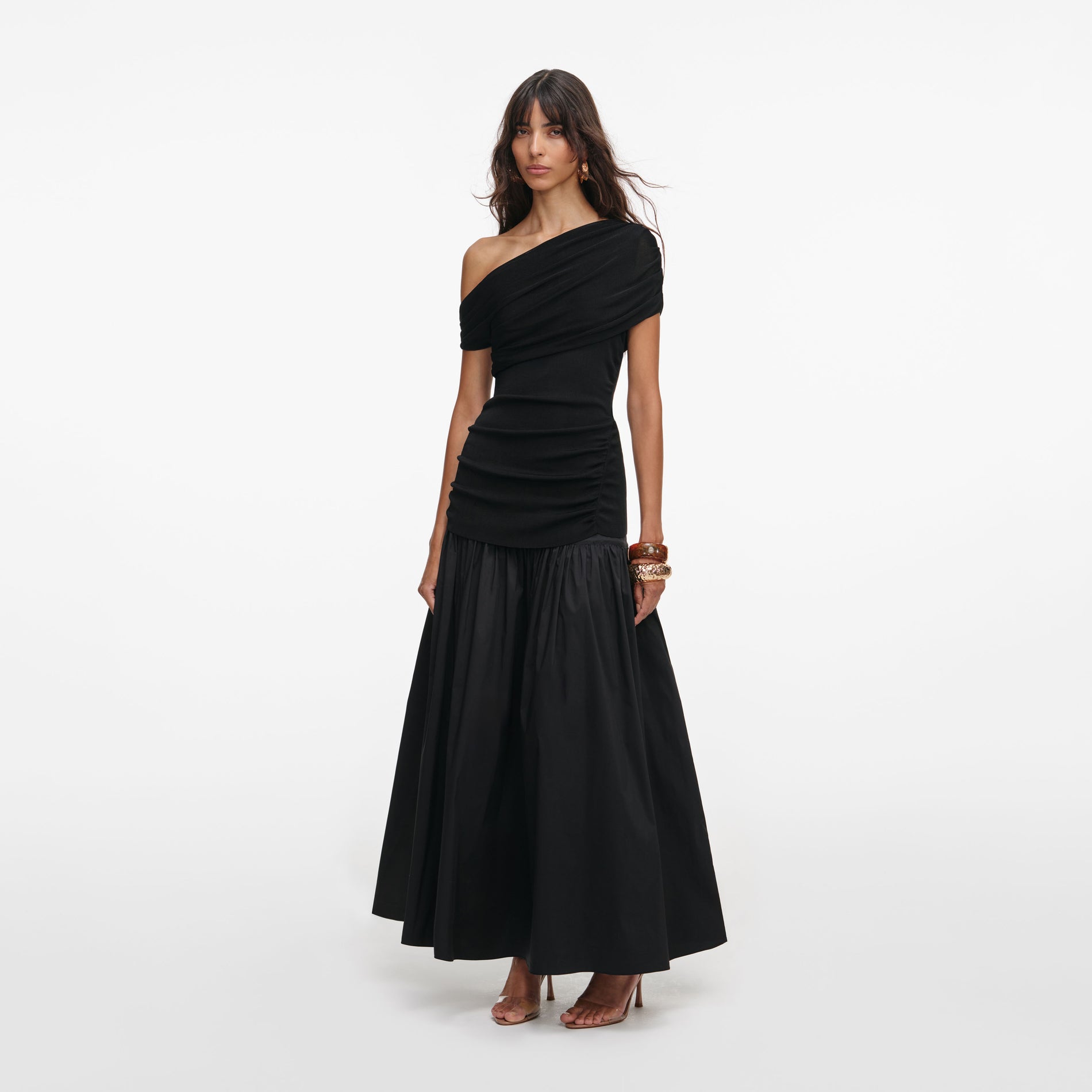 Side view of a woman wearing the Black Cotton Draped Knit Midi Dress