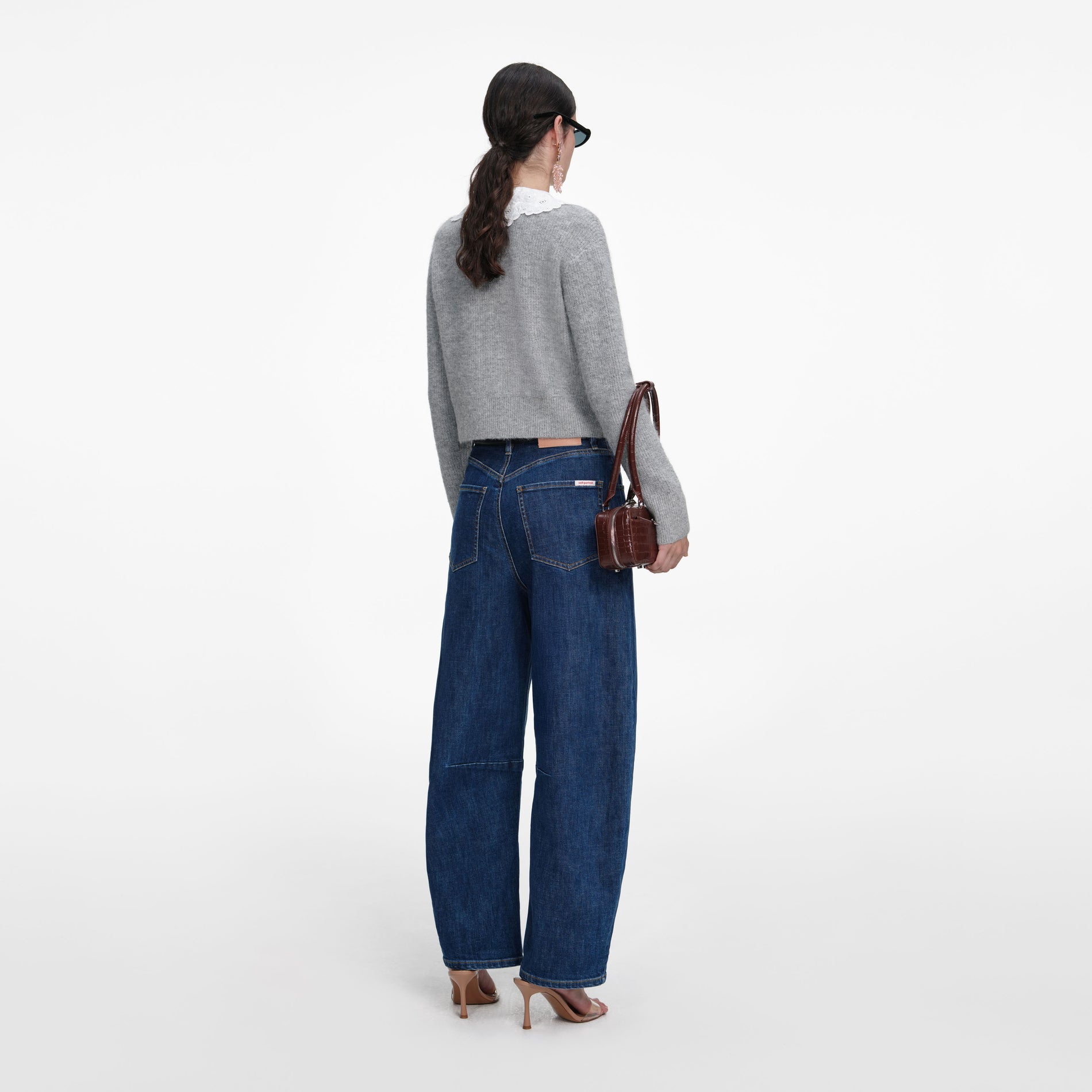 Back view of a woman wearing the Grey Lace Collar Cardigan