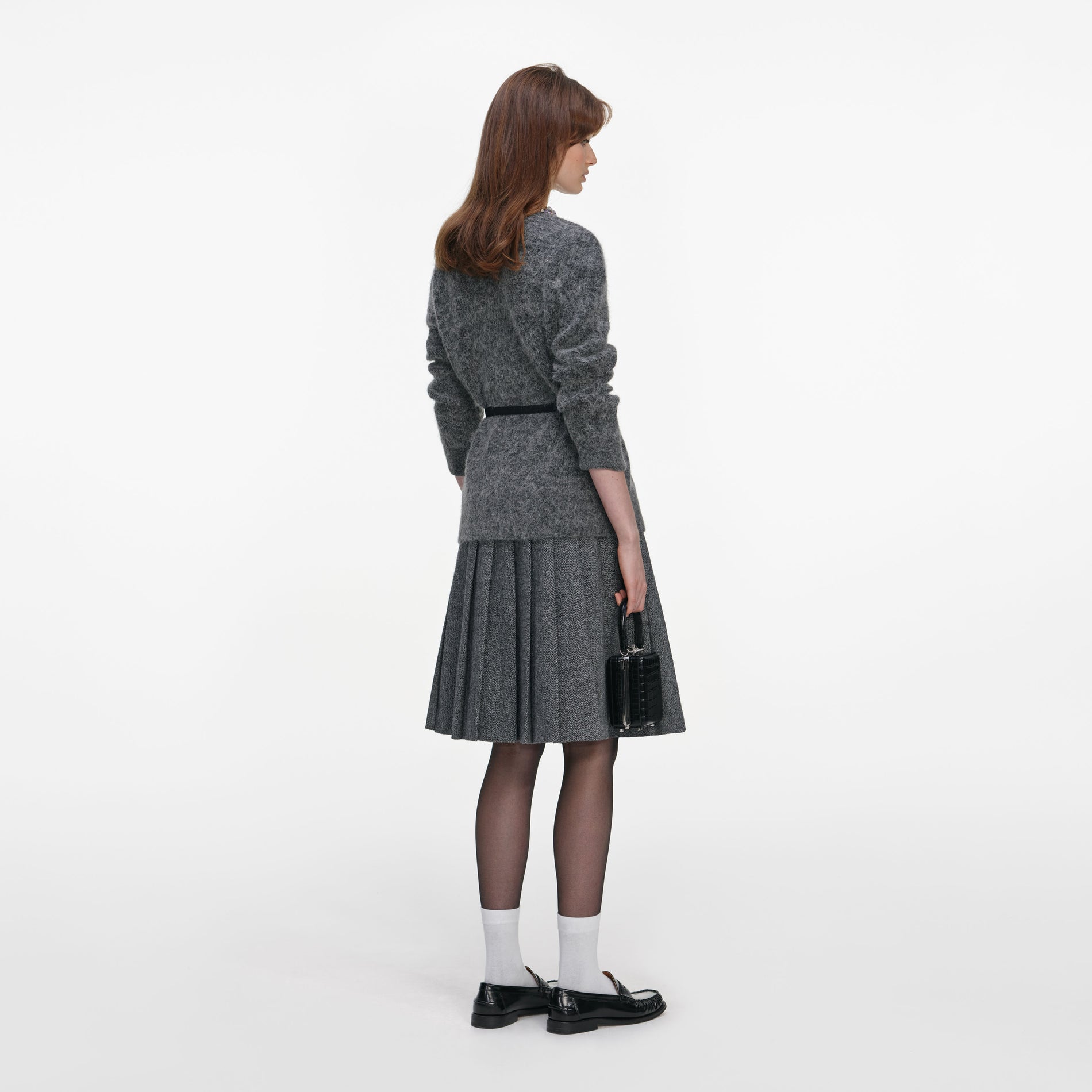 Back view of a woman wearing the Charcoal Crystal Trim Cardigan