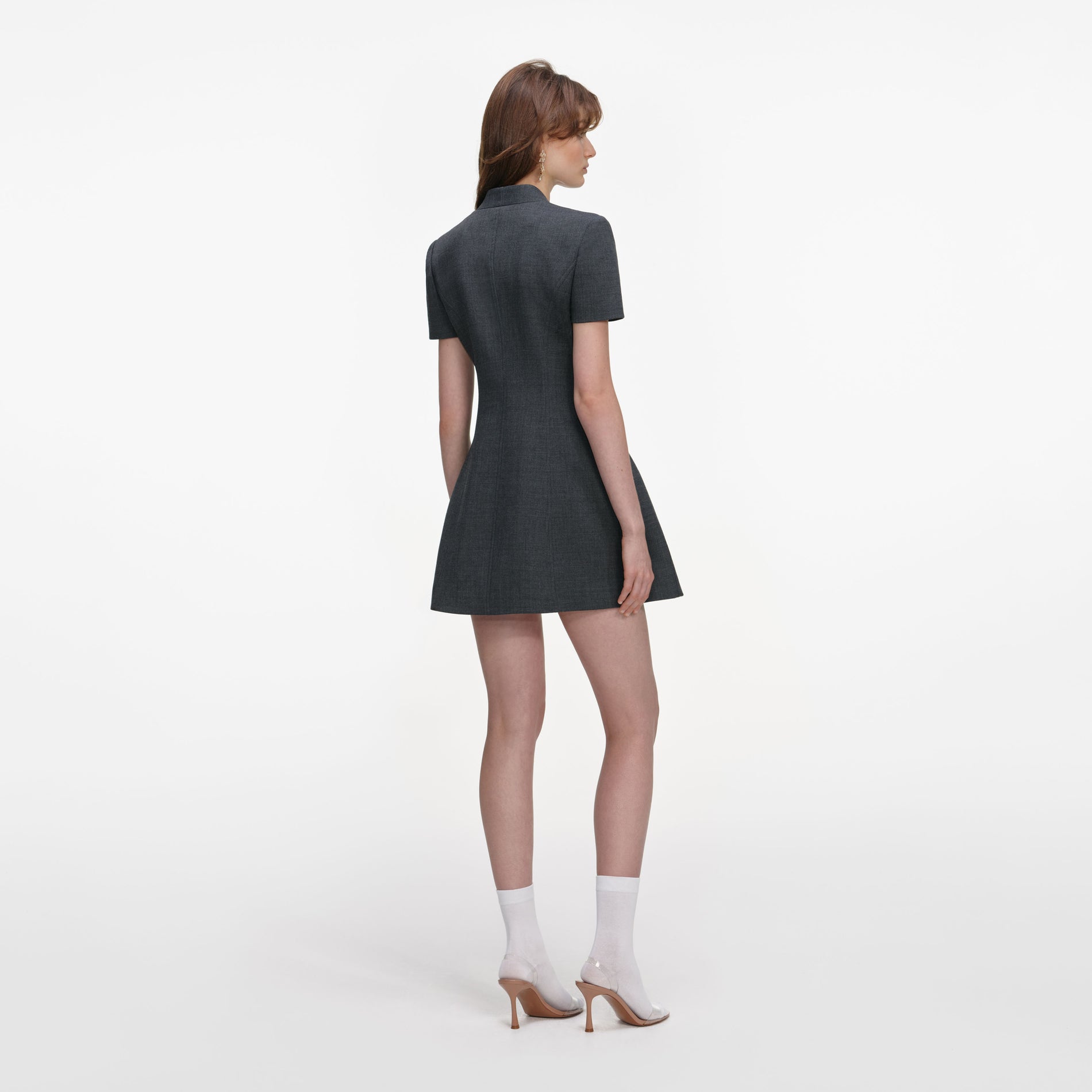 Back view of a woman wearing the Grey Tailored Flower Detail Mini Dress