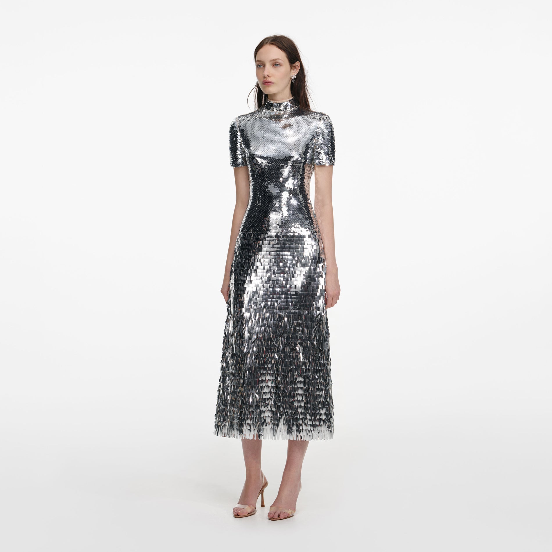 Side view of a woman wearing the Silver Gradient Sequin Midi Dress