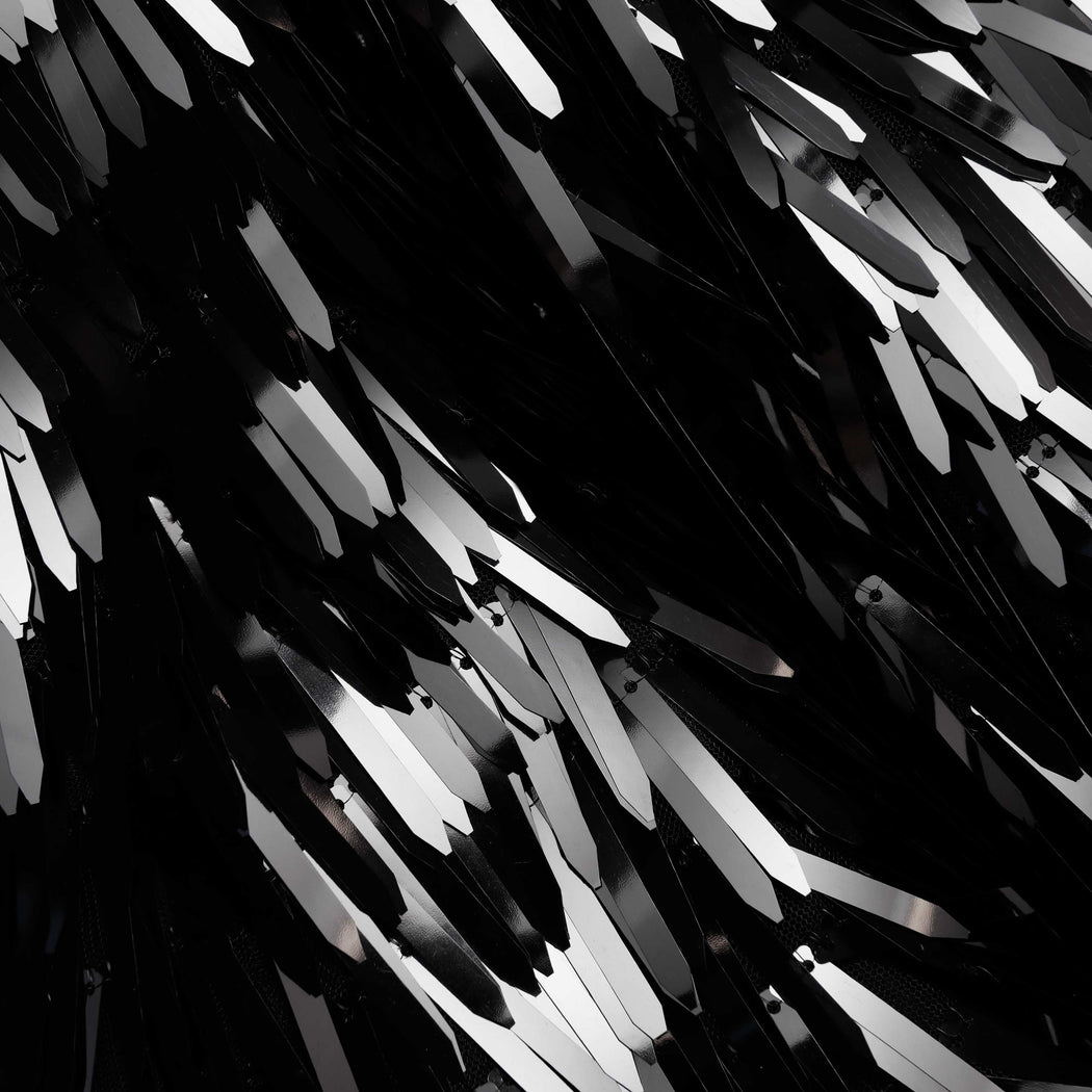 A close up of the fabric for the Black Sequin Top