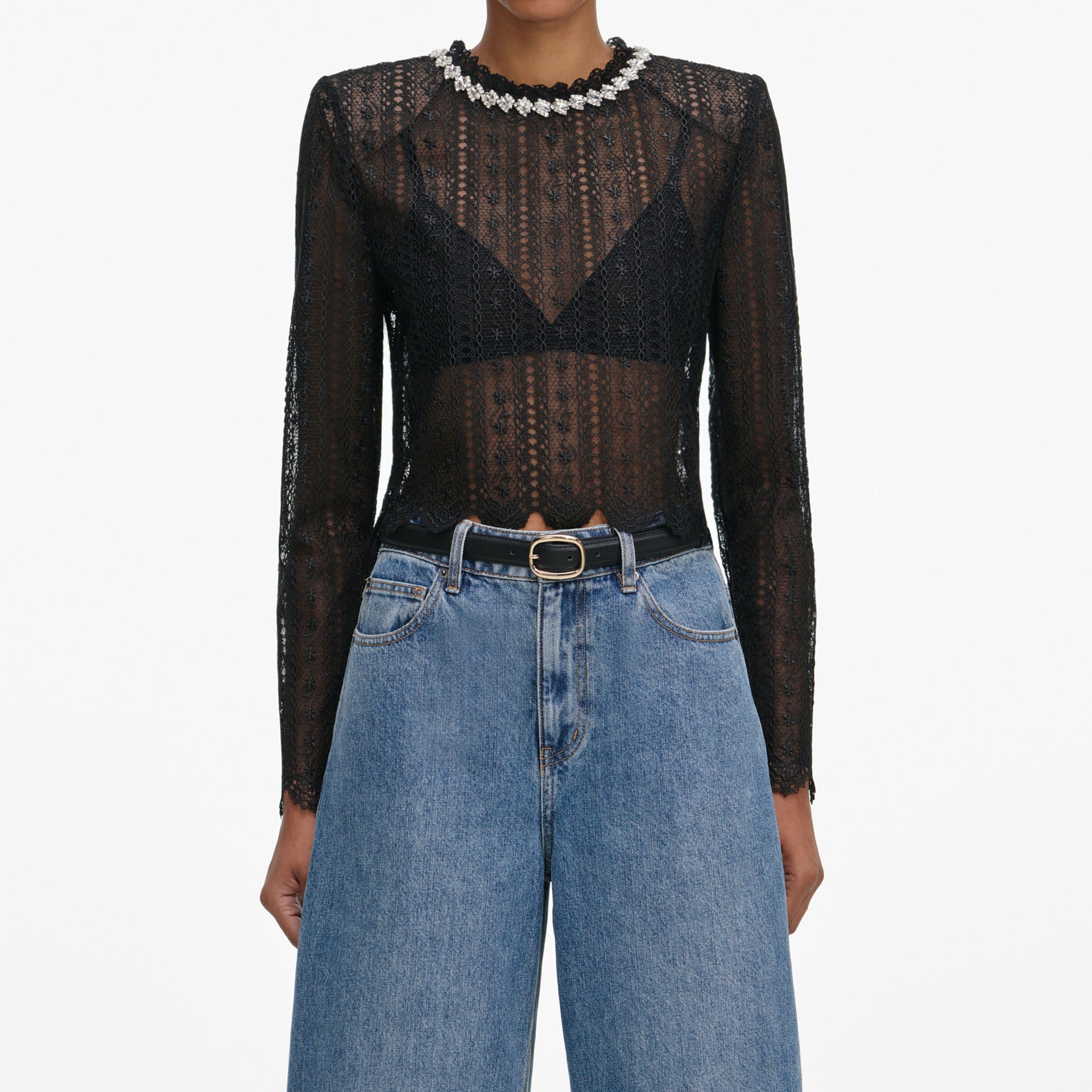 A close up of a woman wearing the Black Organza Lace Top