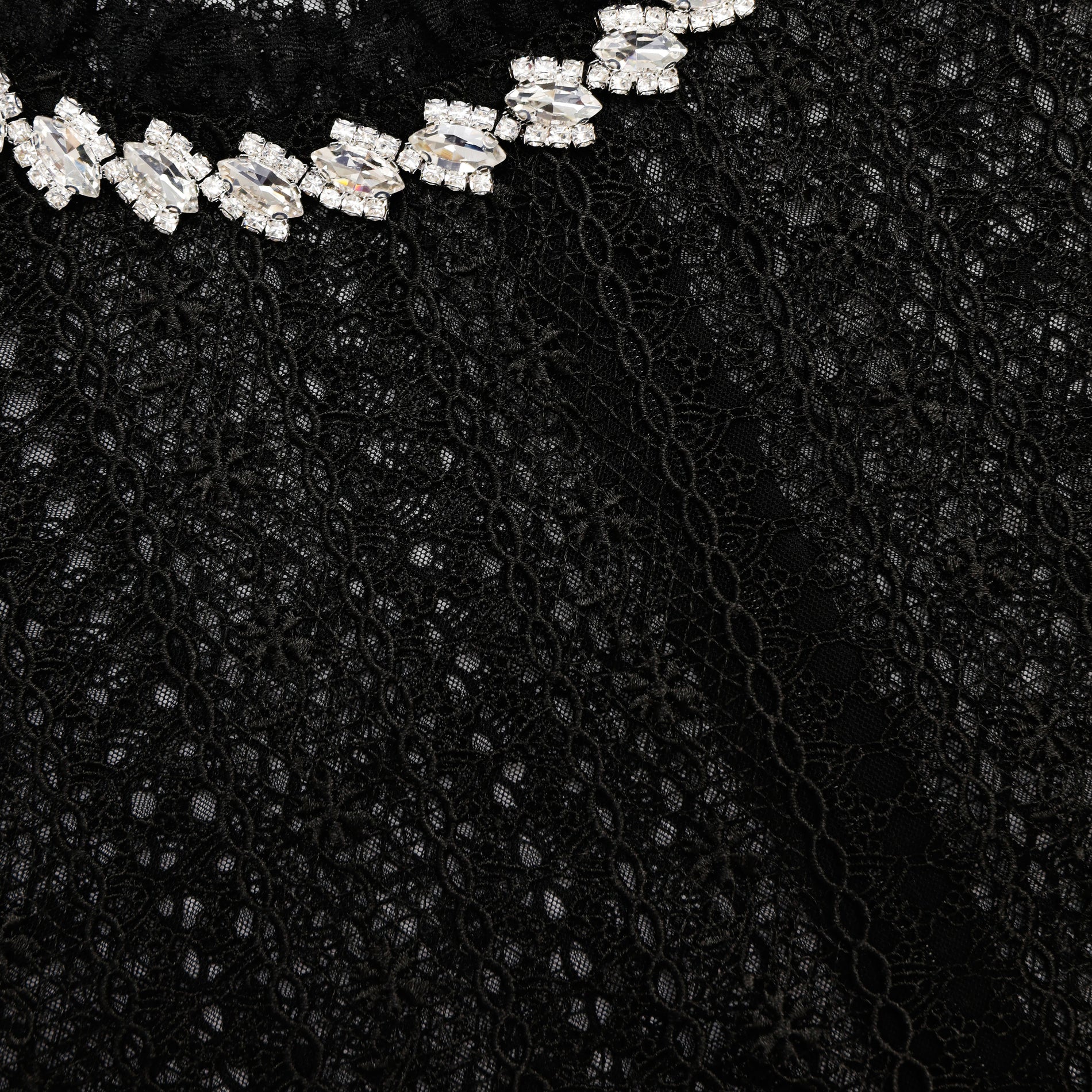 A close up of the fabric for the Black Organza Lace Top