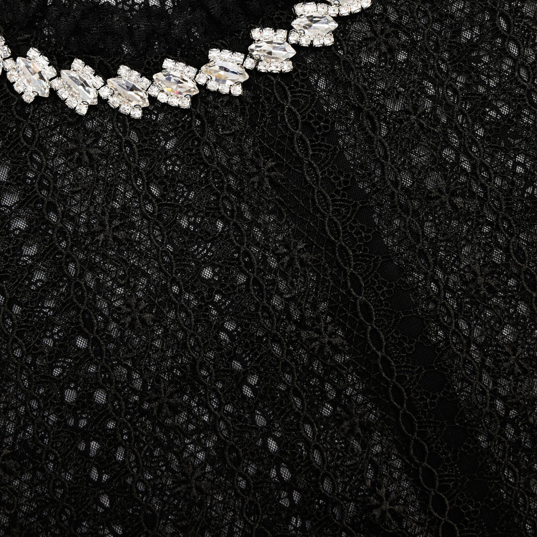 A close up of the fabric for the Black Organza Lace Top