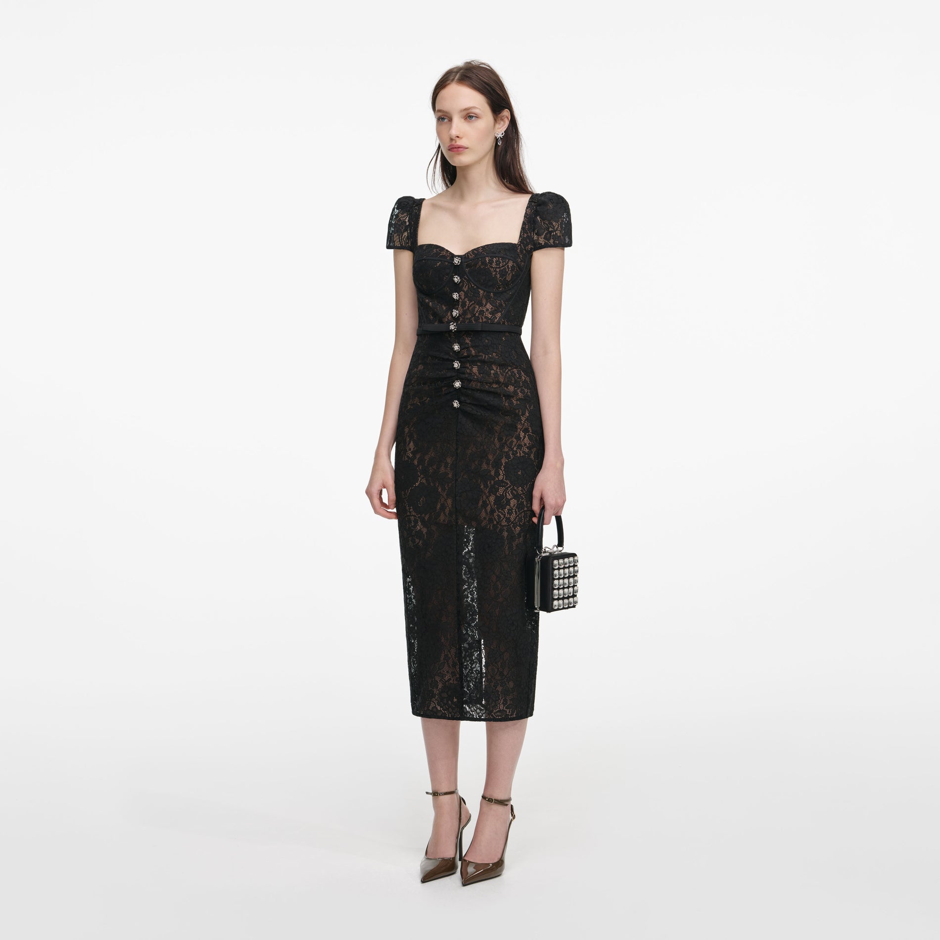Side view of a woman wearing the Black Sweetheart Lace Midi Dress