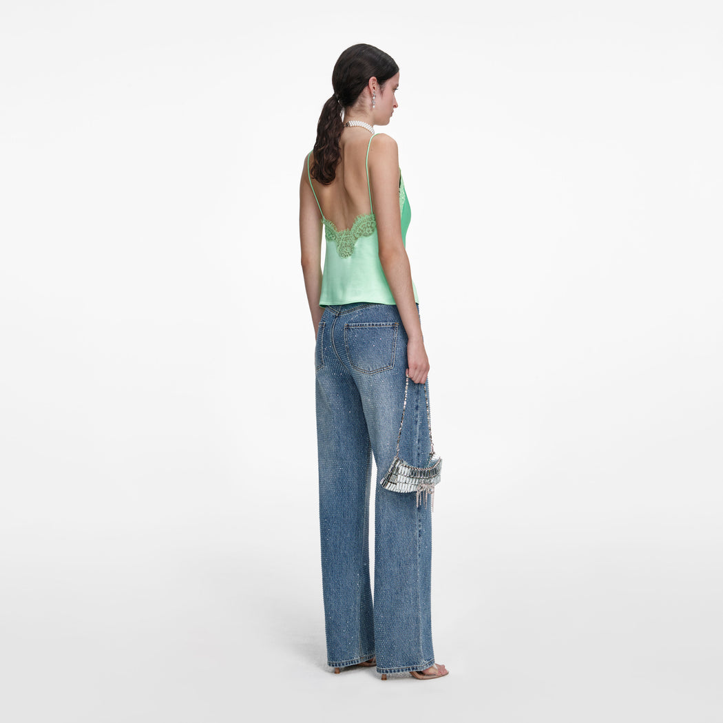 Back view of a woman wearing the Green Satin Lace Top