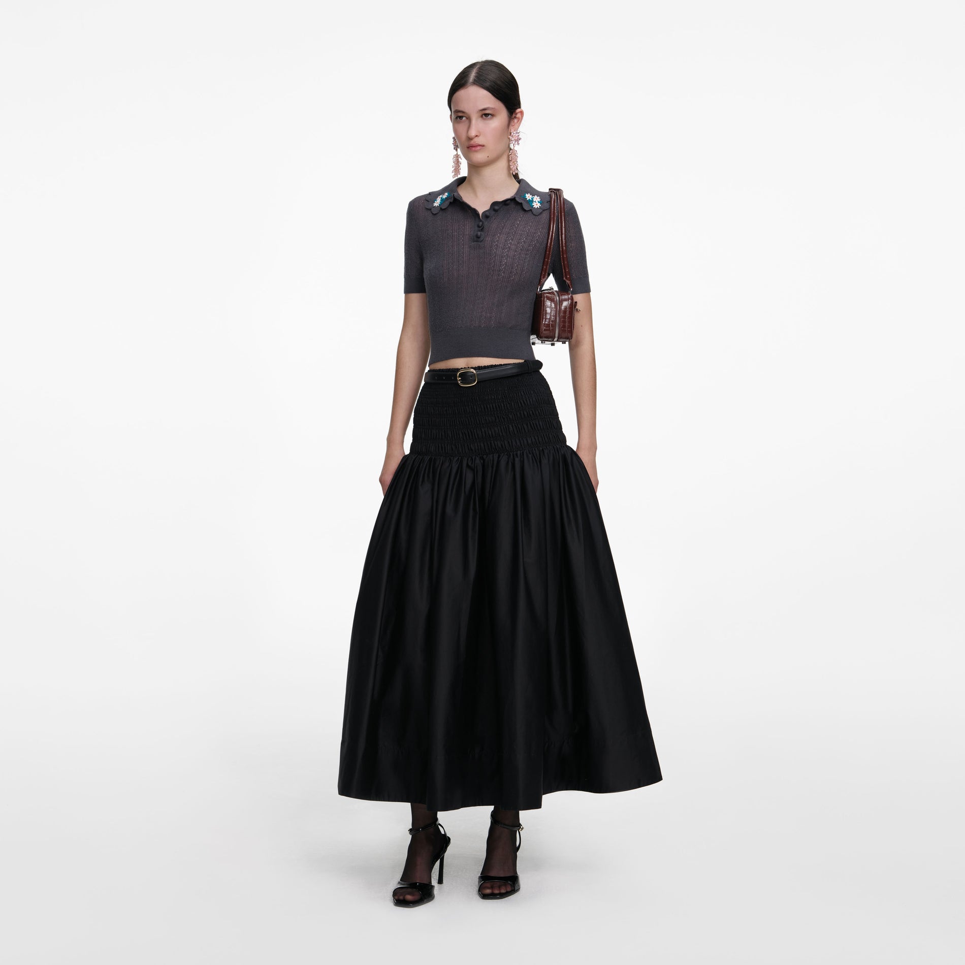 Side view of a woman wearing the Grey Embroidered Pointelle Knit Top