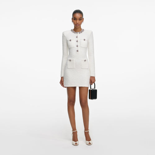 Front view of a woman wearing the Cream Crystal Trim Knit Mini Dress