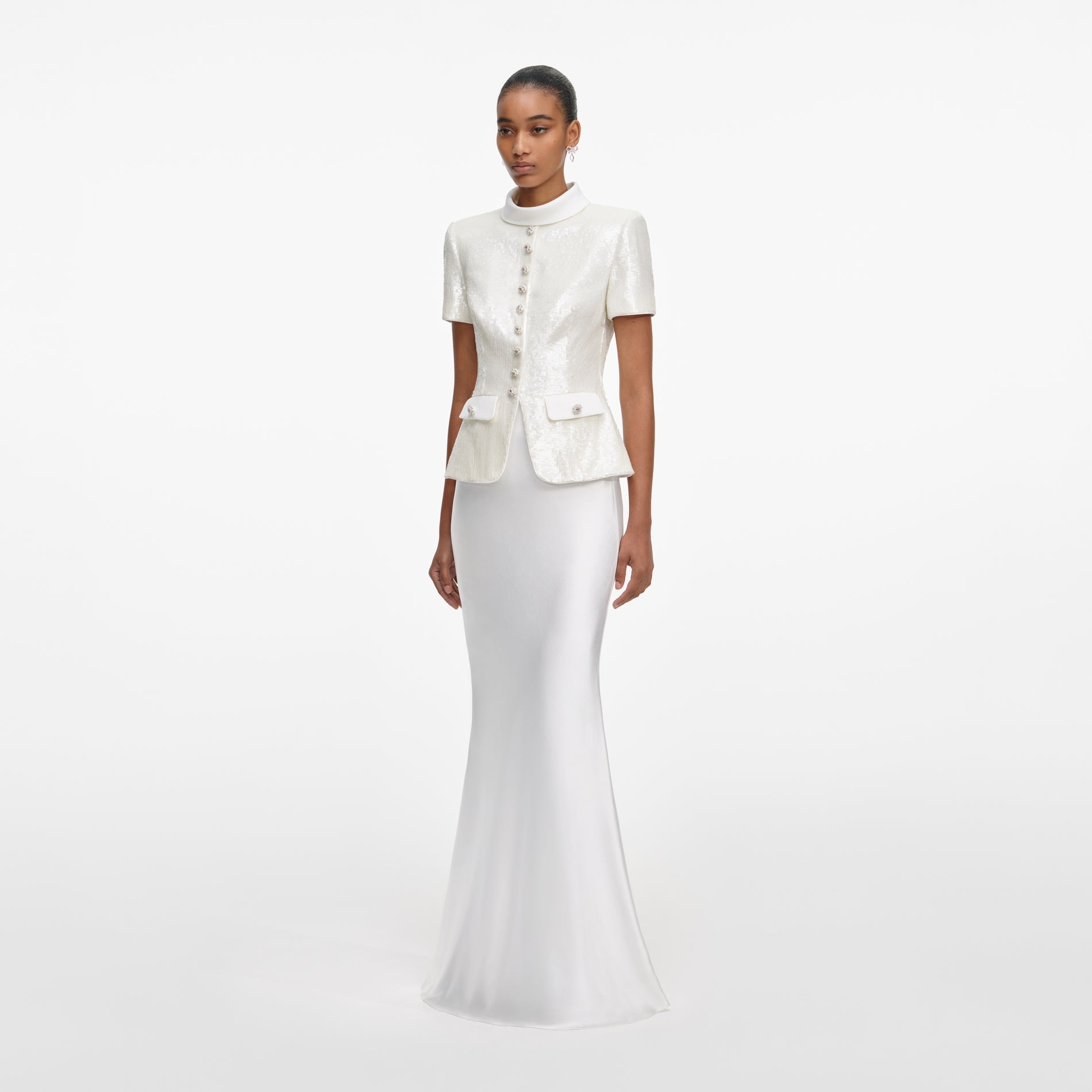 Side view of a woman wearing the White Sequin Tailored Maxi Dress