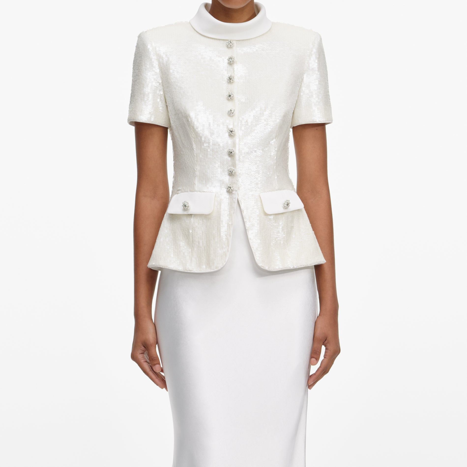 A close up of a woman wearing the White Sequin Tailored Maxi Dress