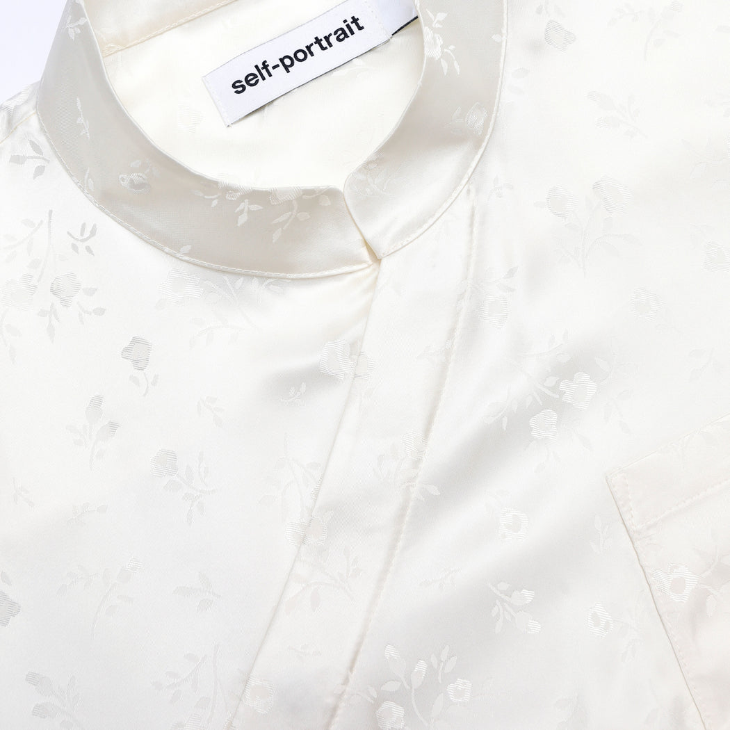 A close up of the fabric for the Cream Satin Jacquard Blouse