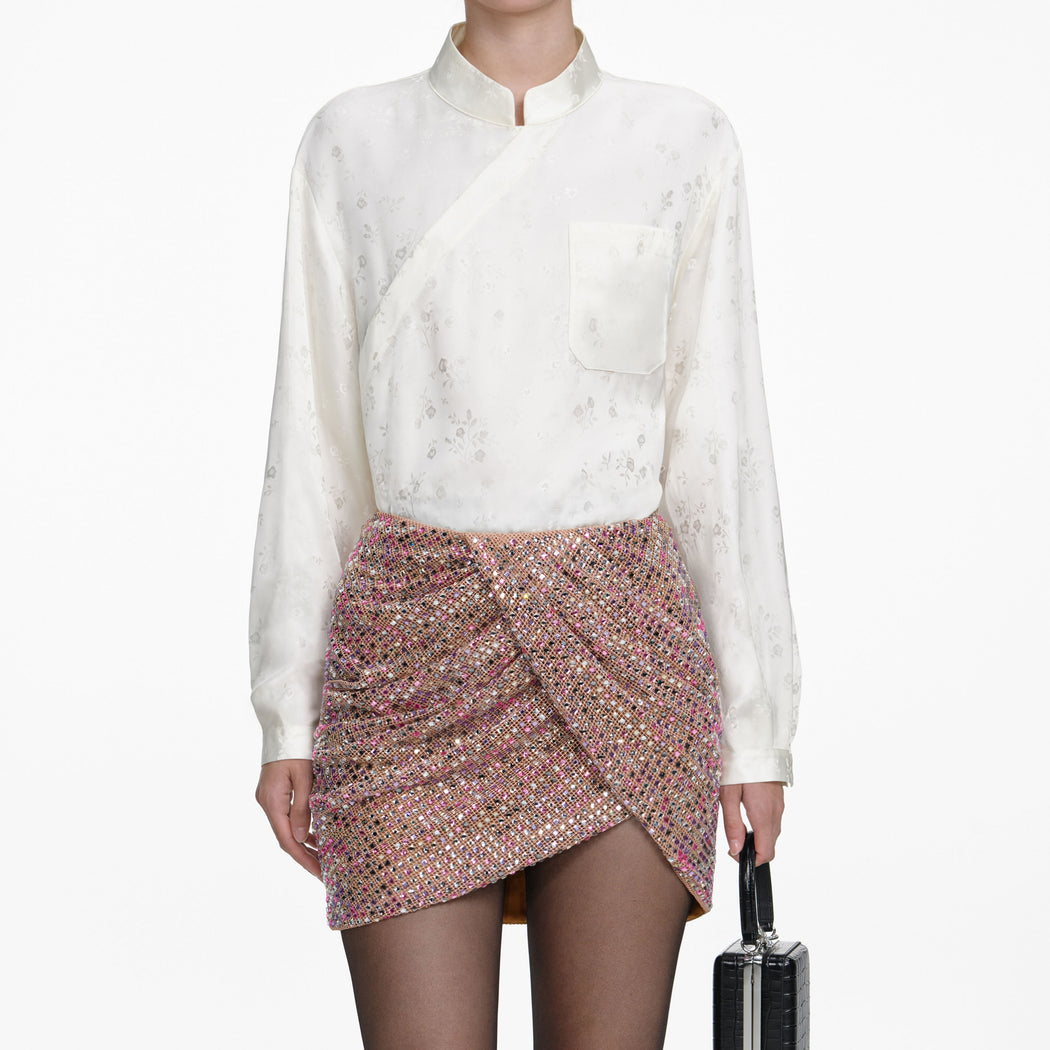 A close up of a woman wearing the Cream Satin Jacquard Blouse