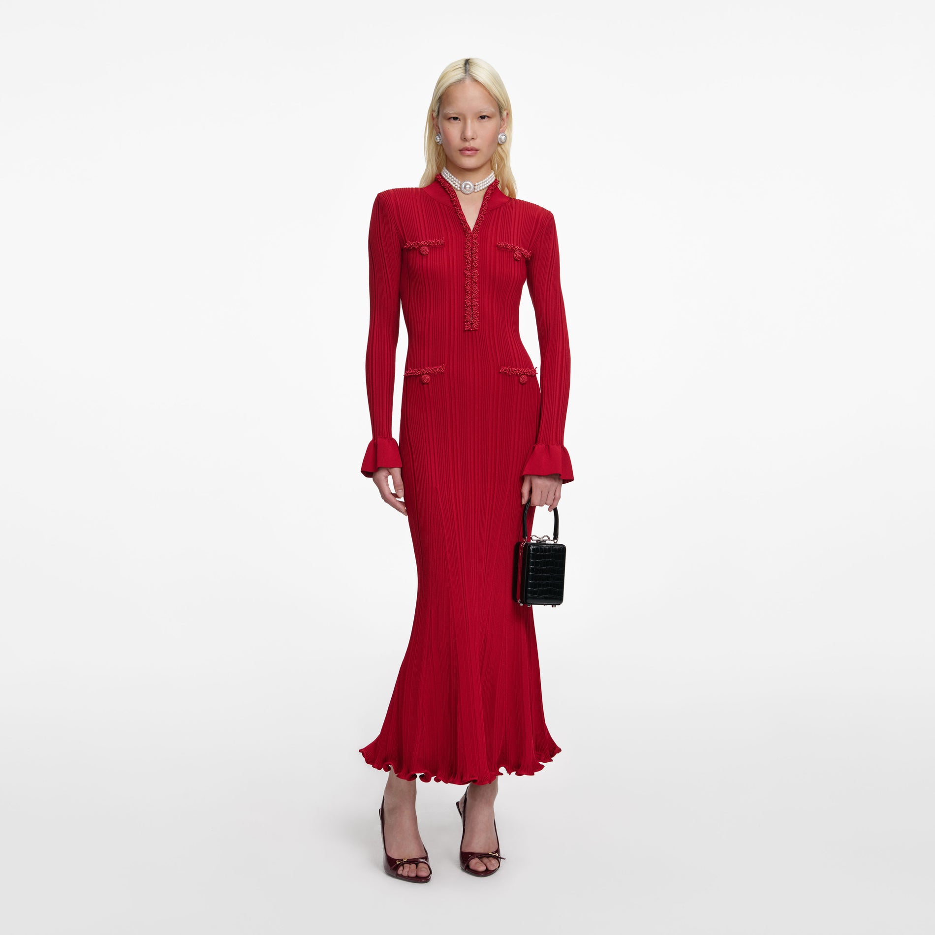 Front view of a woman wearing the Red Pearl Trim Knit Midi Dress