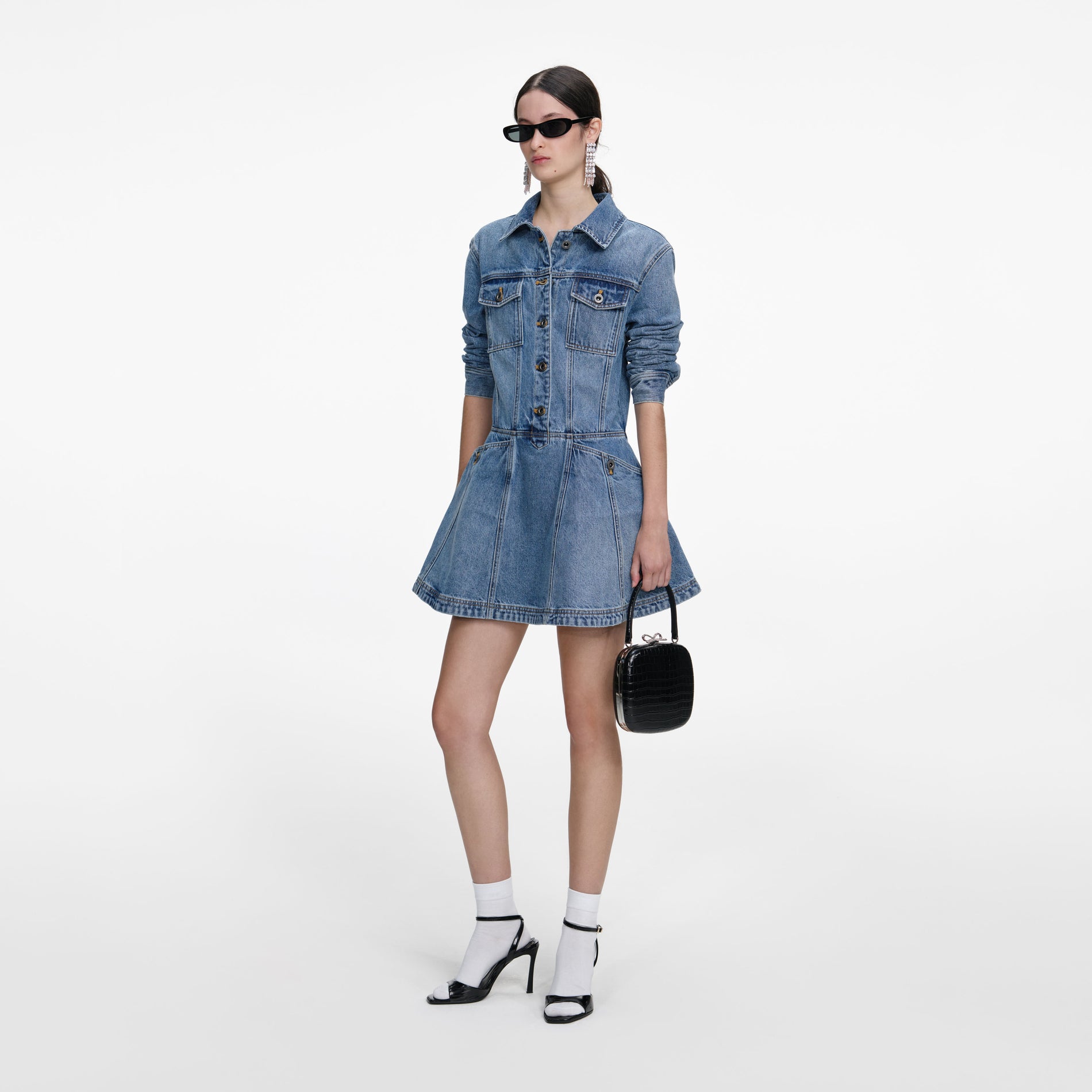 Side view of a woman wearing the Denim Mini Shirt Dress