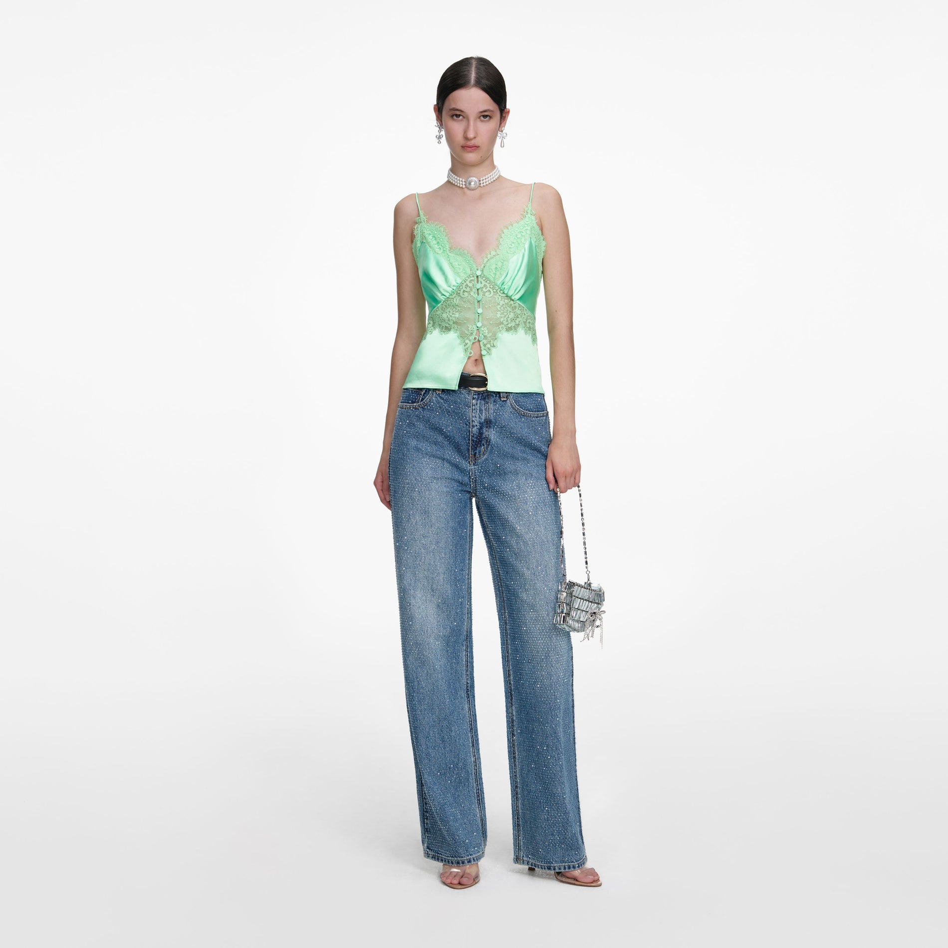 Front view of a woman wearing the Rhinestone Denim Straight Leg Jeans