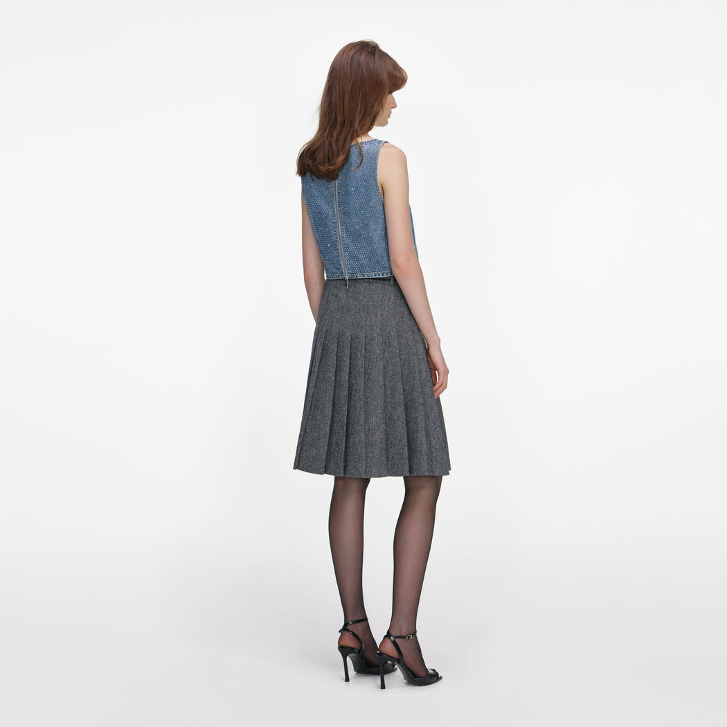 Back view of a woman wearing the Rhinestone Denim Crop Top