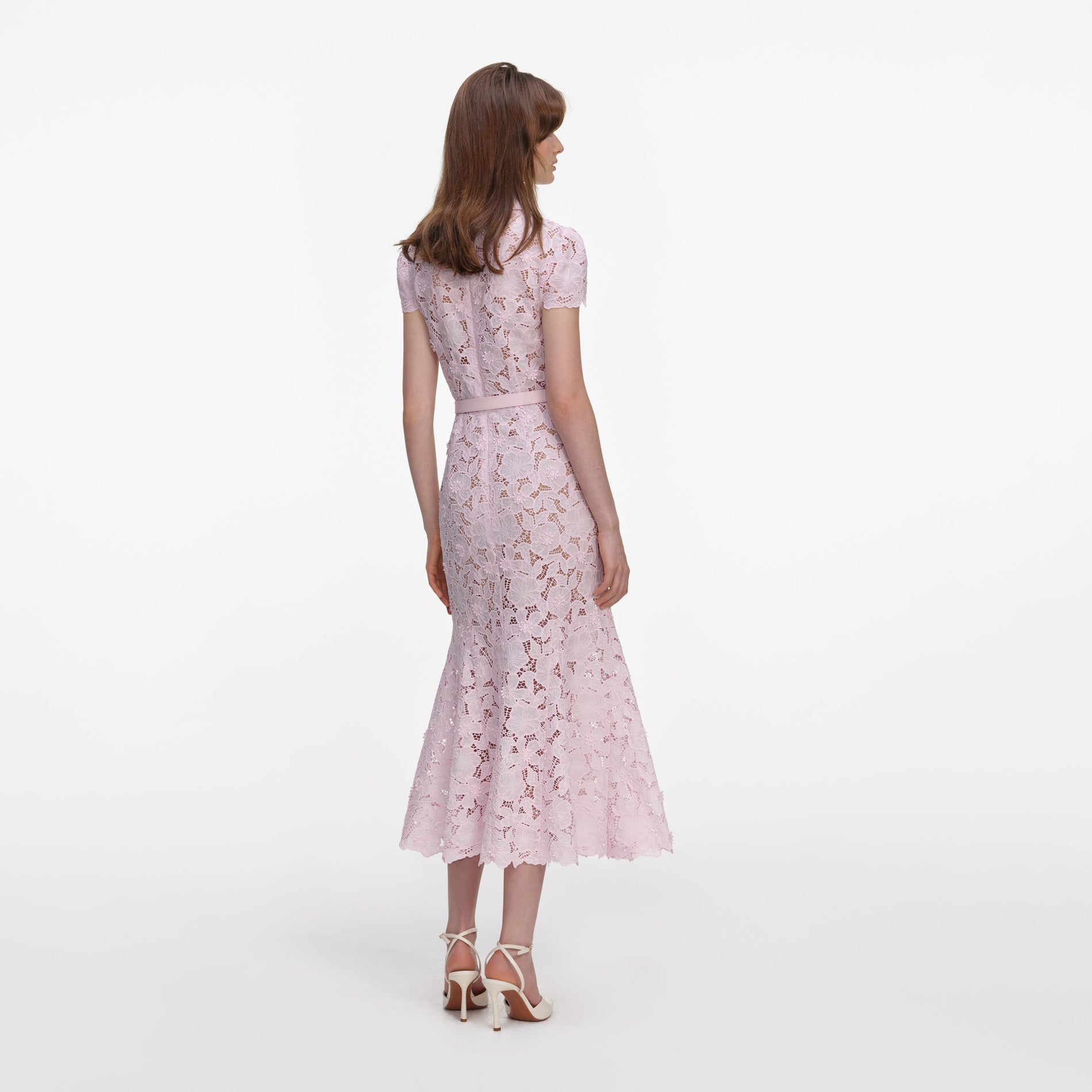 Back view of a woman wearing the Pink Guipure Lace Midi Dress
