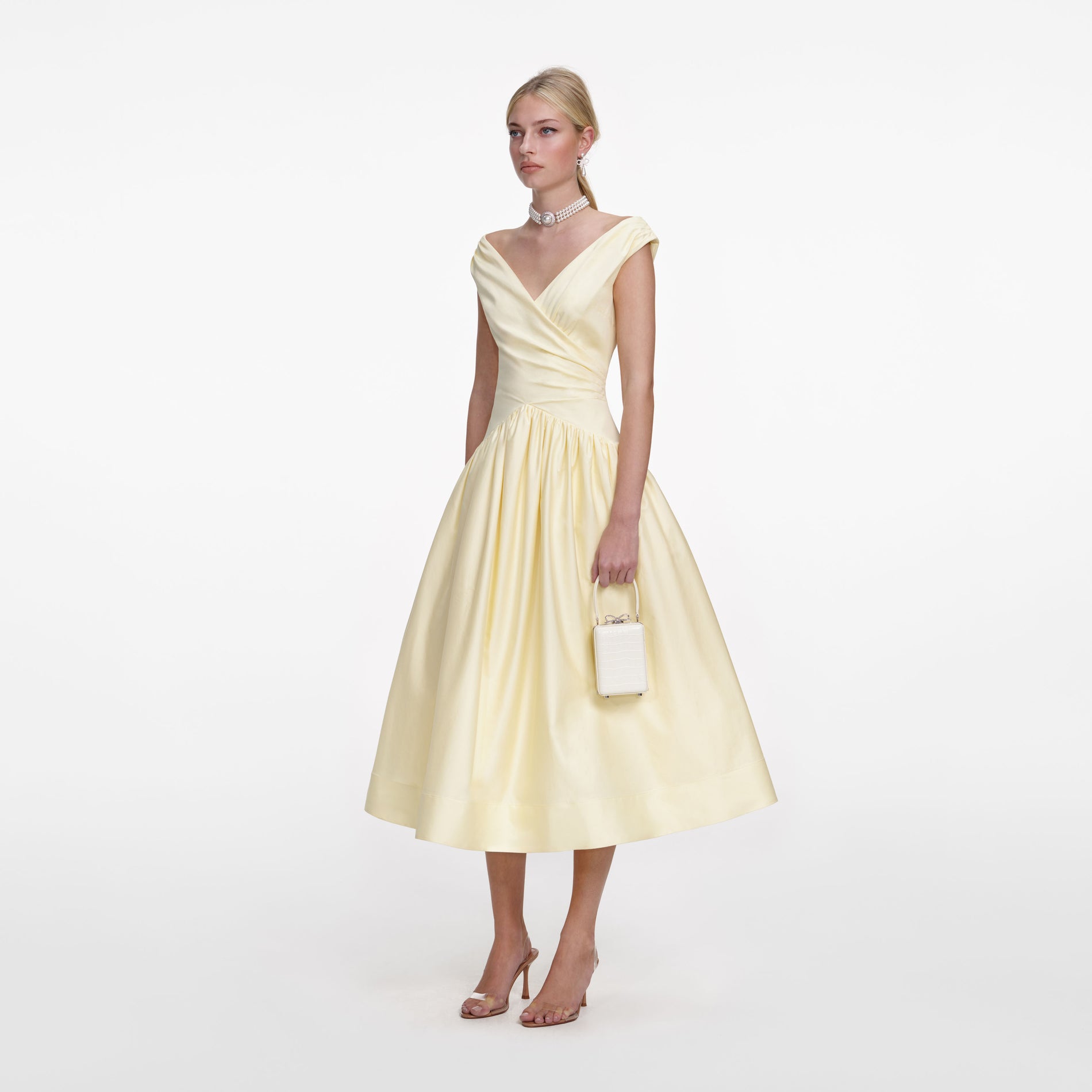 Side view of a woman wearing the Yellow Cotton Midi Dress