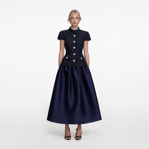Front view of a woman wearing the Navy Metallic Boucle Taffeta Midi Dress