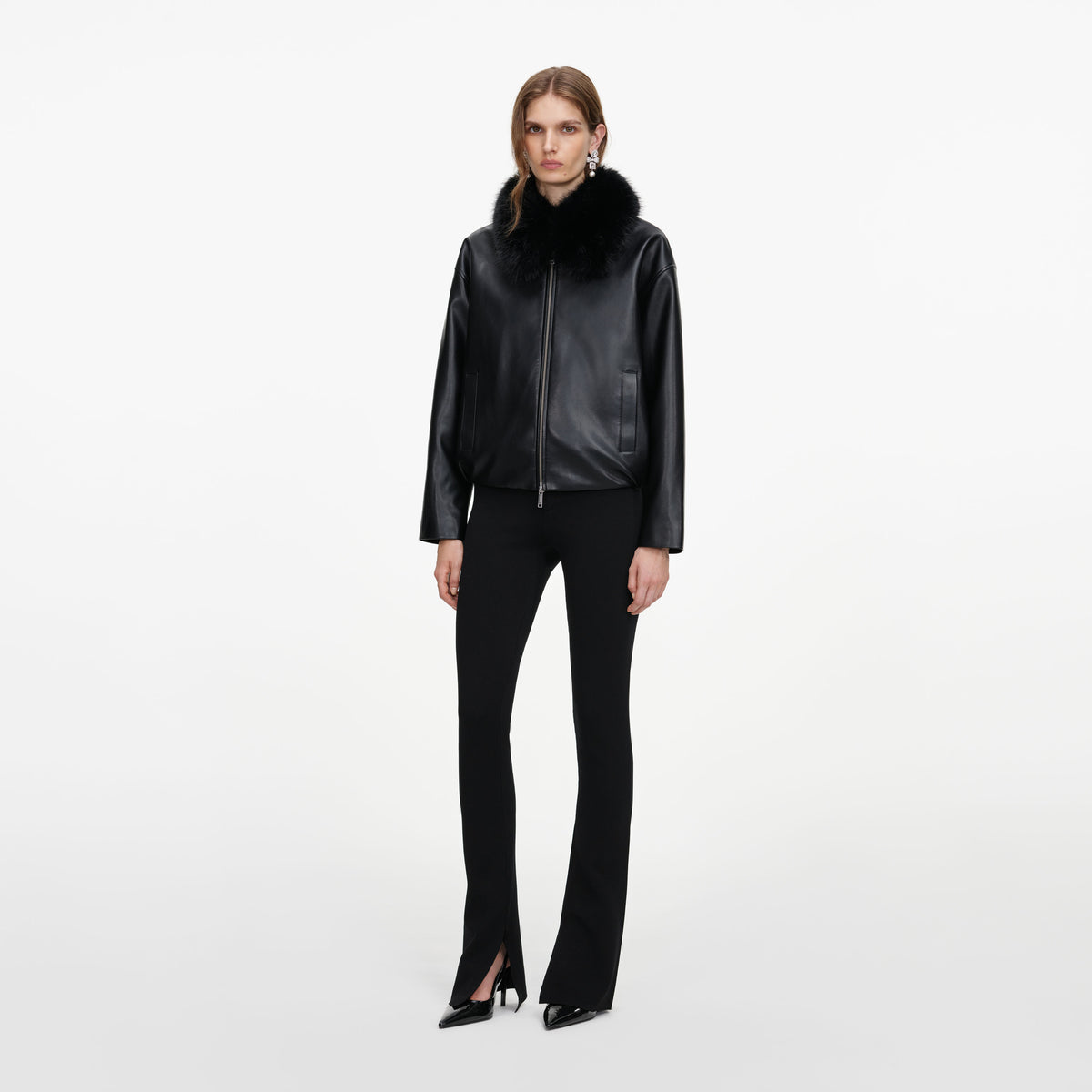 Side view of a woman wearing the Black Faux Leather Bomber Jacket