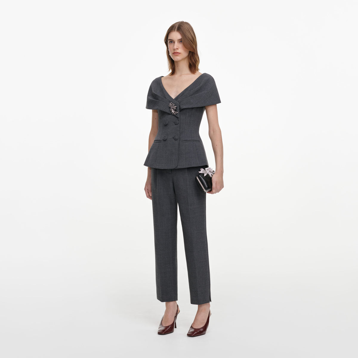 Side view of a woman wearing the Grey Tailored Brooch Jumpsuit