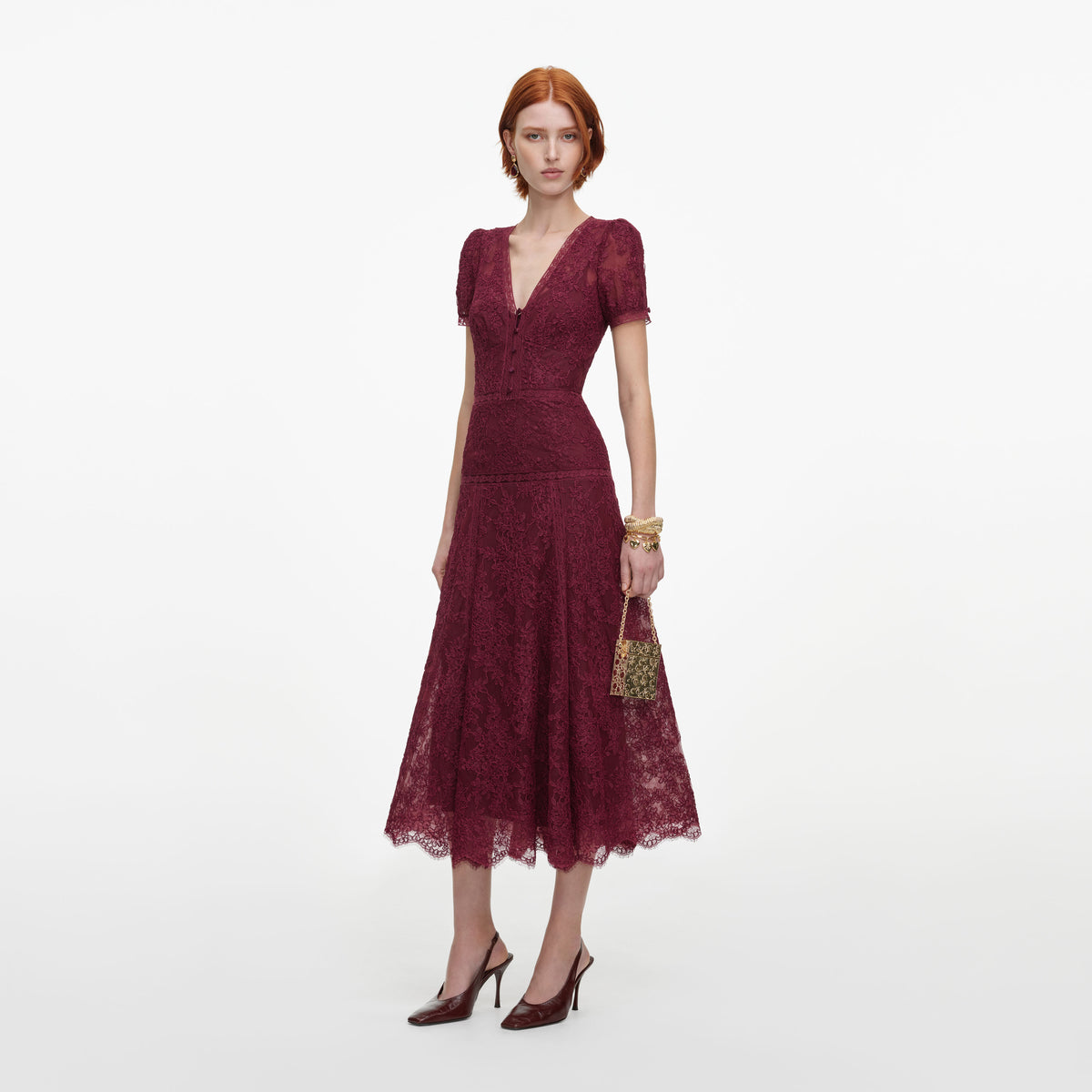 Side view of a woman wearing the Burgundy Lace Midi Dress