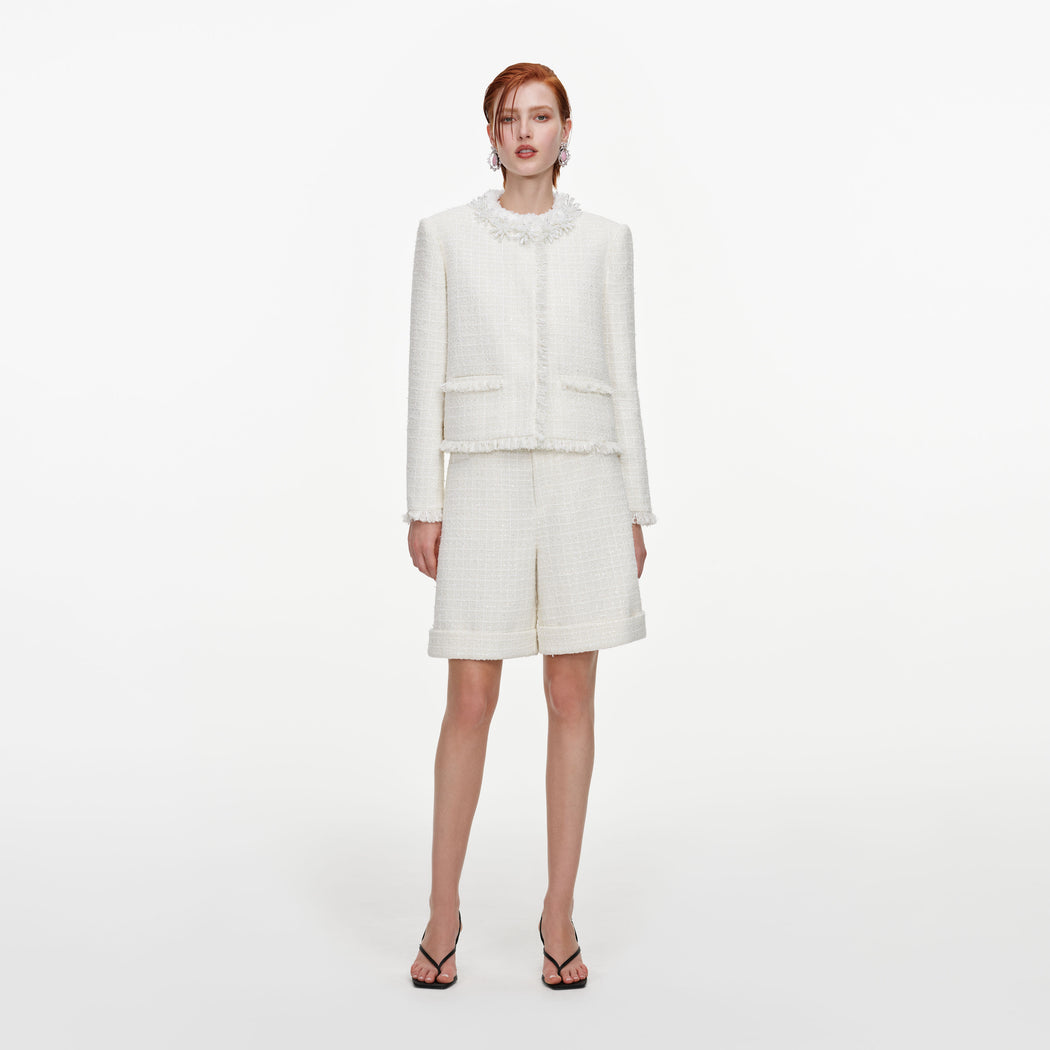 Front view of a woman wearing the Cream Sequin Boucle Pearl Trim Jacket