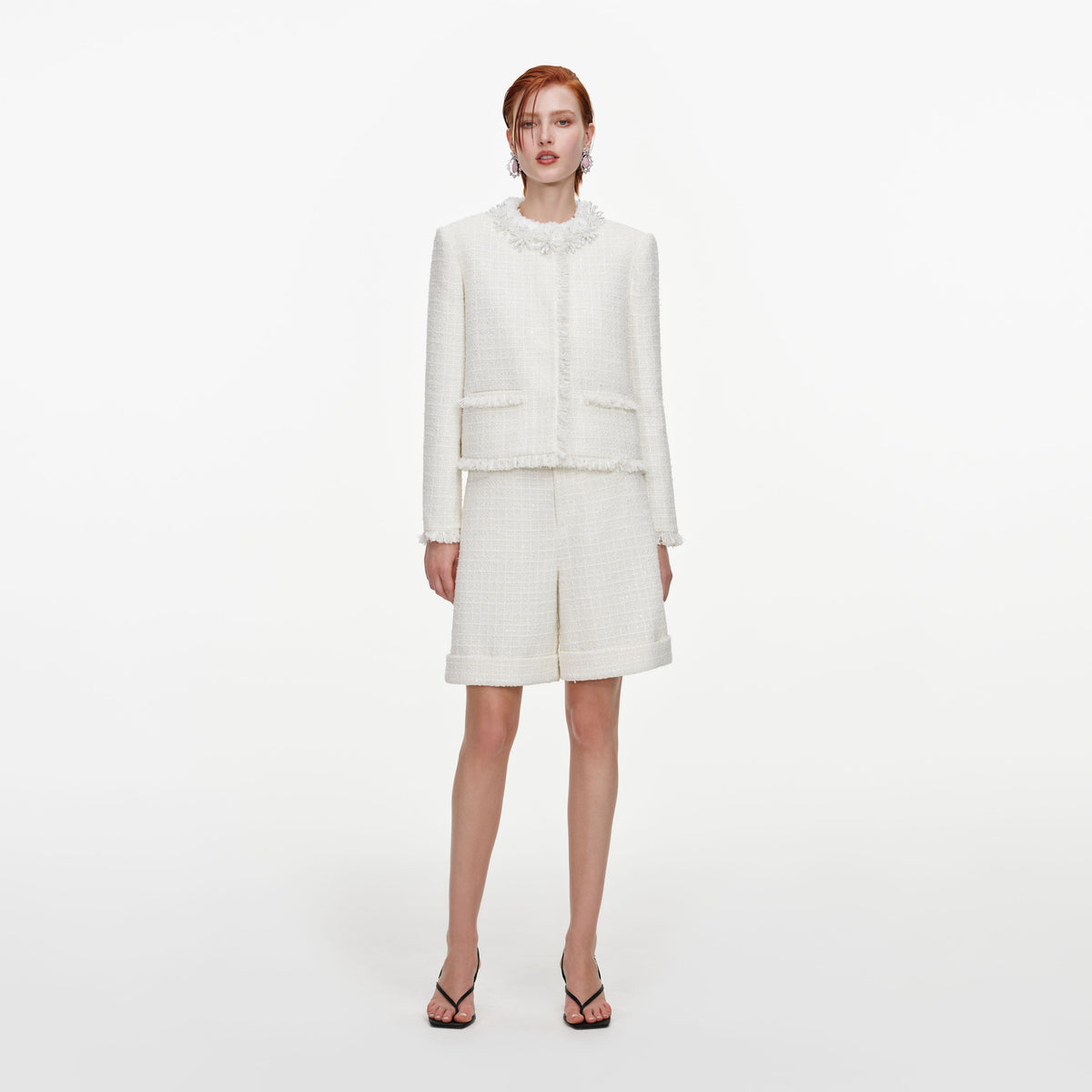 Front view of a woman wearing the Cream Sequin Boucle Pearl Trim Jacket