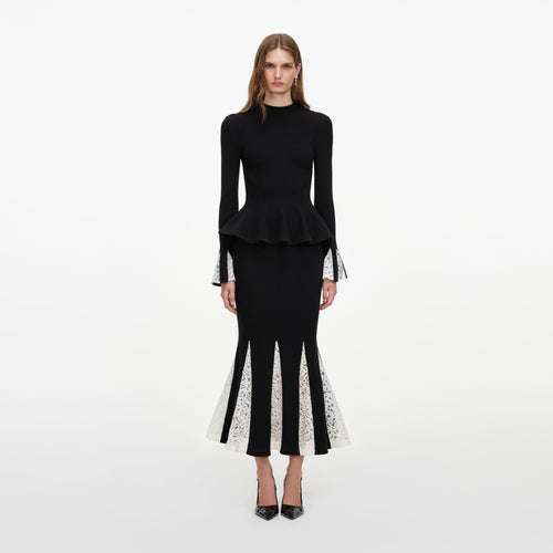 Front view of a woman wearing the Black Lace Insert Knit Midi Dress