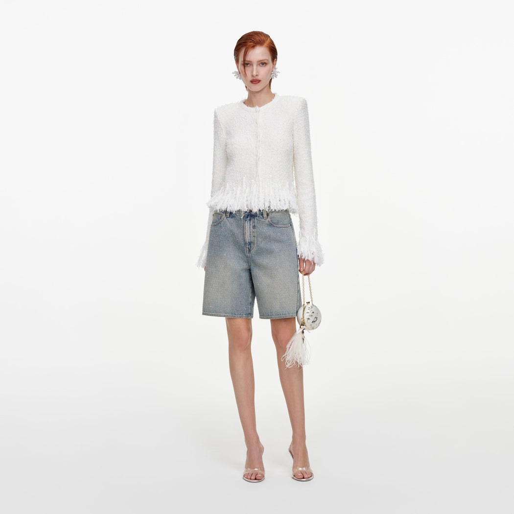 Front view of a woman wearing the White Fringe Knit Cardigan
