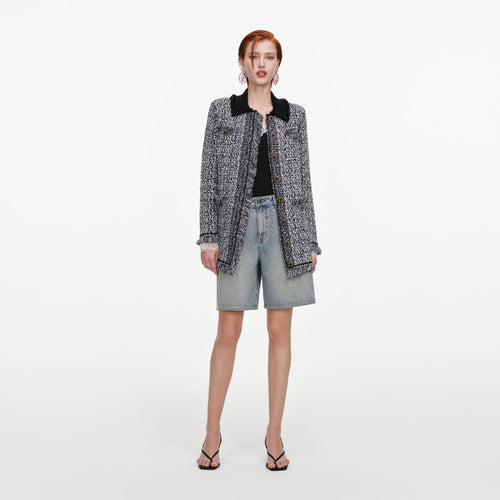 Front view of a woman wearing the Black And White Textured Knit Cardigan