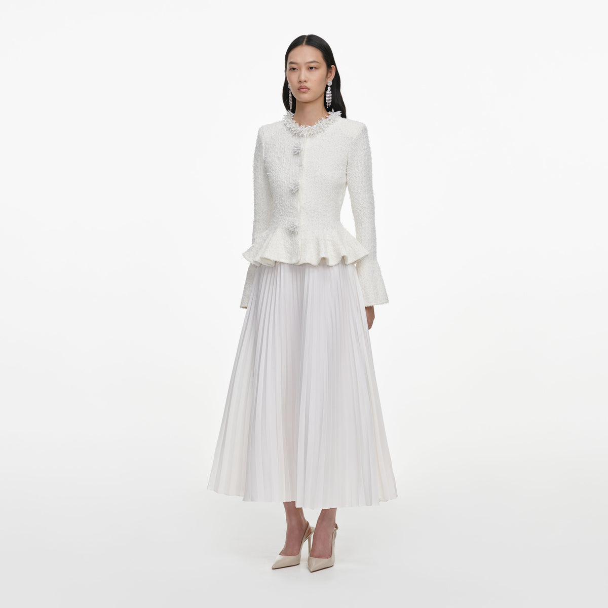 Side view of a woman wearing the White Textured Knit Chiffon Midi Dress