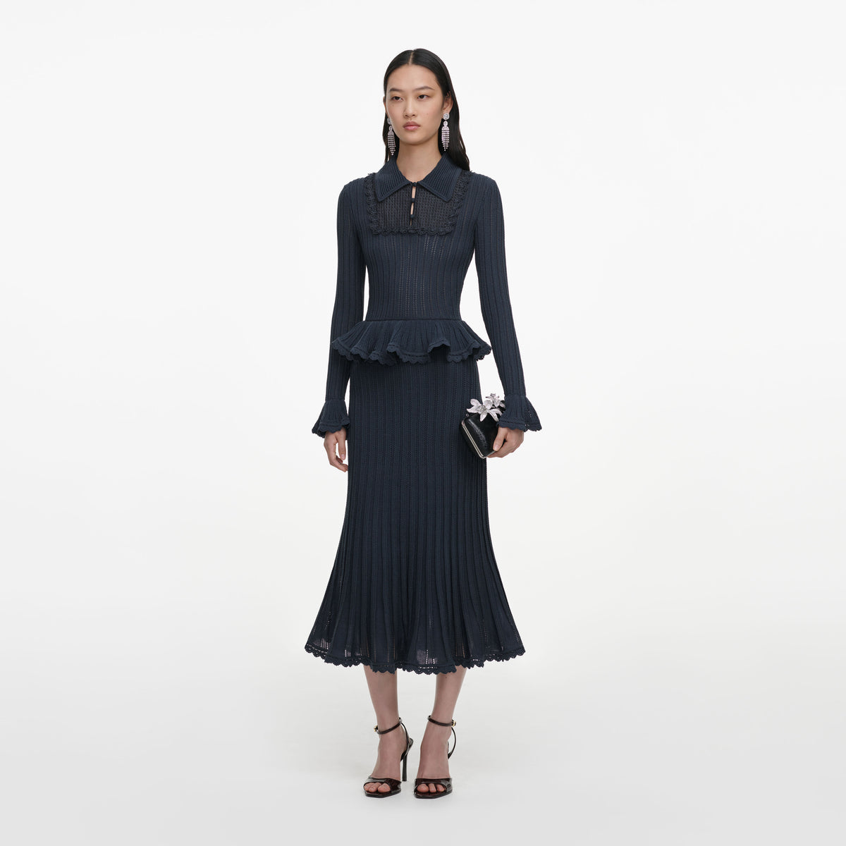 Side view of a woman wearing the Grey Peplum Pointelle Knit Midi Dress