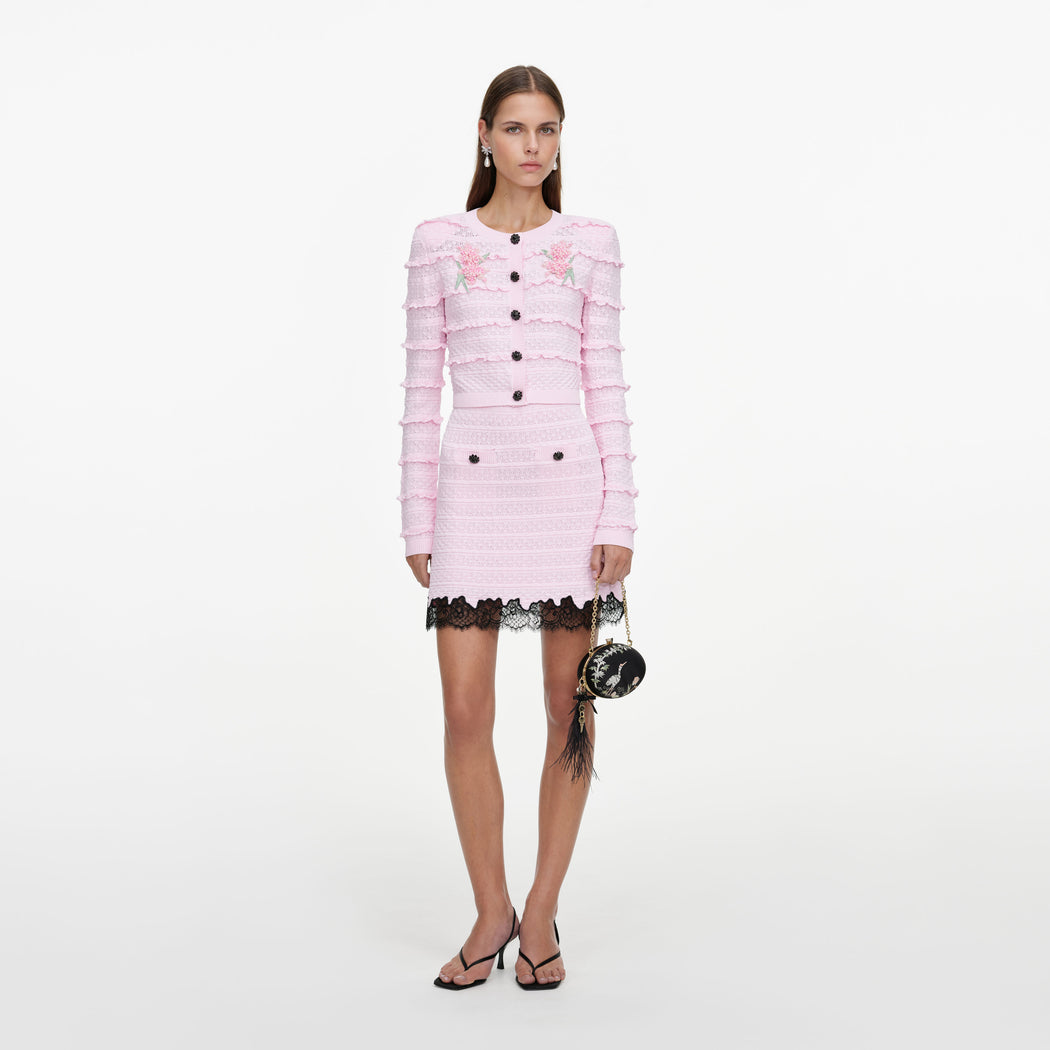 Front view of a woman wearing the Pink Pointelle Knit Skirt